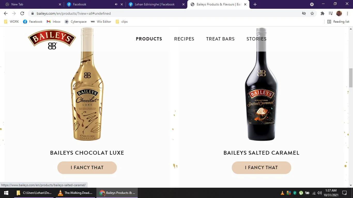 The image is a screenshot from the Baileys website, displaying two of their liqueur products. On the left is a bottle of "Baileys Chocolat Luxe." The bottle is gold with elegant, swirling patterns and the Baileys logo prominently displayed. The text reads "Baileys Chocolat Luxe" at the center. On the right is a bottle of "Baileys Salted Caramel," with a dark, sleek design featuring the Baileys logo and an illustration of caramel spilling over a dessert. Both products have a button below labeled "I FANCY THAT." The website's navigation bar at the top includes options such as "PRODUCTS," "RECIPES," "TREAT BARS," and "STORIES." The overall design is clean and minimalist, with a focus on the visual appeal of the Baileys products. The background is white, highlighting the vibrancy of the bottles.
