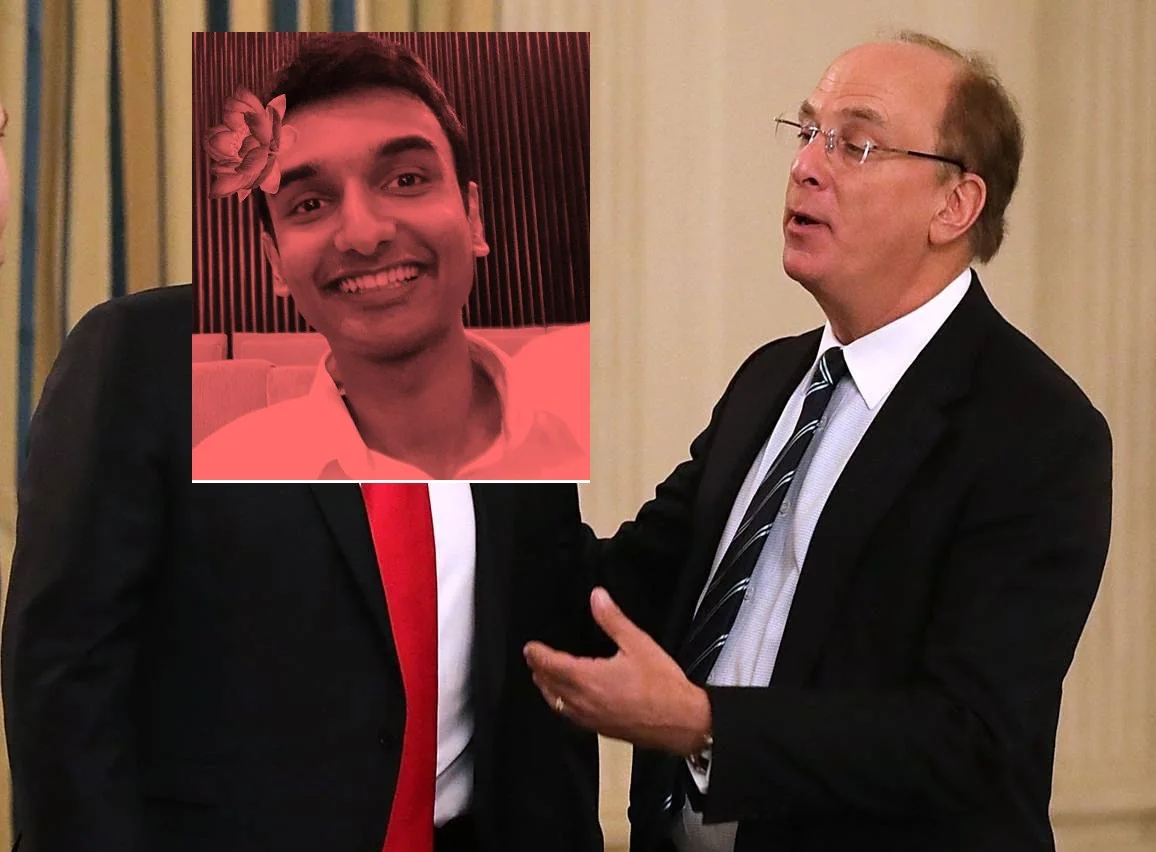 The image appears to show a business or formal event, set indoors with a curtain in the background. The scene is bright, suggesting ample lighting, possibly from overhead lights, given the formal setting. In the image, Larry Fink, wearing a dark suit, a white shirt, and a striped tie, is engaged in conversation. His posture is open, with one hand gesturing as if making a point or emphasizing his speech. He appears to be speaking to someone next to him.
However, the image has been edited. The face of the person next to him has been replaced with a photoshopped photo of Lehan Edirisinghe, who is smiling broadly. The added face has a red tint and includes a decorative flower in the hair, contrasting with the otherwise formal attire of a suit and red tie. The editing creates a humorous and surreal element to the image, blending a casual, playful portrait into a formal setting. The overall composition is centered on the interaction between the two figures, with the focus on the contrast between the serious and casual elements created by the photoshopping.