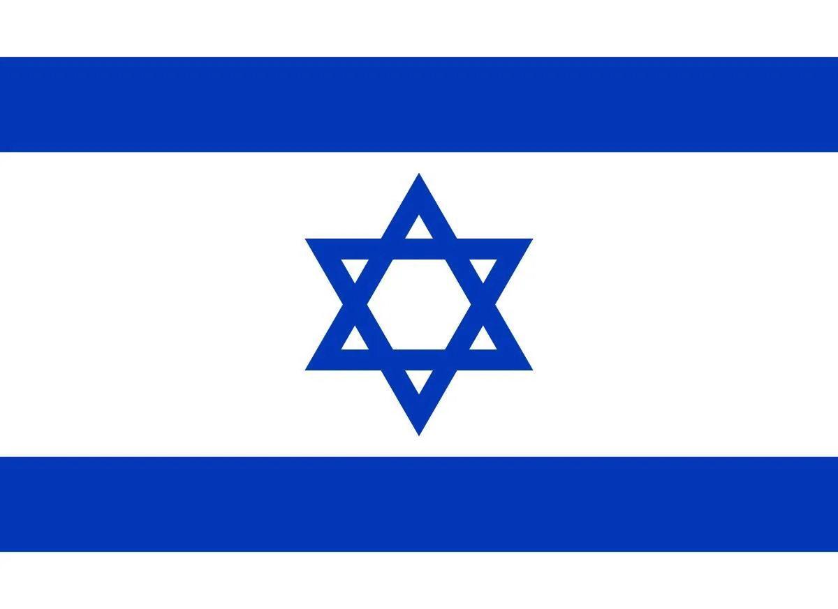 The image shows the national flag of Israel. It features two horizontal blue stripes near the top and bottom edges against a white background. In the center, there is a blue Star of David, a prominent symbol in Judaism, which is composed of two overlapping equilateral triangles forming a hexagram. The design is simple yet distinctive, using only two colors: blue and white. The flag's elements are symmetrically aligned, conveying a sense of balance and harmony. The use of blue stripes is said to be inspired by the traditional Jewish prayer shawl, known as a tallit. This flag is typically associated with themes of national identity, cultural heritage, and religious significance.