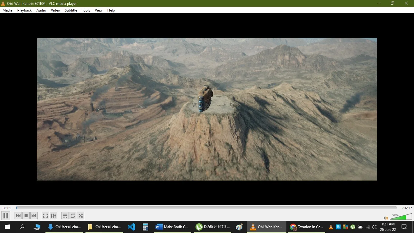 The image is a screenshot from the VLC media player showing a scene from the series "Obi-Wan Kenobi," specifically from Season 1, Episode 4. The scene captures a barren, rocky landscape with a spaceship hovering above a flat-topped mountain. The terrain is rugged and expansive, with numerous hills and valleys stretching out into the distance, suggesting an alien or otherworldly setting typical of science fiction landscapes.
In the foreground, the spaceship is centrally positioned, appearing metallic and advanced. Its design is sleek, with a copper or rust-like color contrasted by more vibrant blue lights or panels visible on its side. The lighting is natural, highlighting the textures of the rocky surface and casting shadows that enhance the depth of the landscape.
The VLC media player interface is visible, with the play controls at the bottom and the title bar at the top indicating the episode of the series being played. The overall mood of the scene is one of isolation and vastness, fitting the adventurous themes of "Obi-Wan Kenobi."