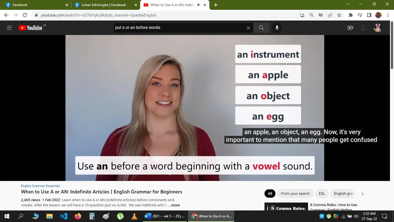 In the image, a screenshot from a YouTube video titled "When to Use A or AN: Indefinite Articles | English Grammar for Beginners" by Sparkle English, a woman stands against a plain background, presumably as a presenter. She has long blonde hair and wears a red top, smiling at the camera. The scene is well-lit, giving it a professional and inviting appearance typical of educational videos. The focus of the video is on the usage of indefinite articles "a" and "an" in English grammar.
On the right side of the frame, text examples such as "an instrument," "an apple," "an object," and "an egg" are displayed, highlighting the rule of using "an" before words that start with a vowel sound. Below these examples, a text strip reads, "Use an before a word beginning with a vowel sound." Captions at the bottom show part of the spoken content: "an apple, an object, an egg. Now, it's very important to mention that many people get confused." The interface displays typical YouTube elements like the title, channel name, and viewer count, reinforcing the educational focus of the content.