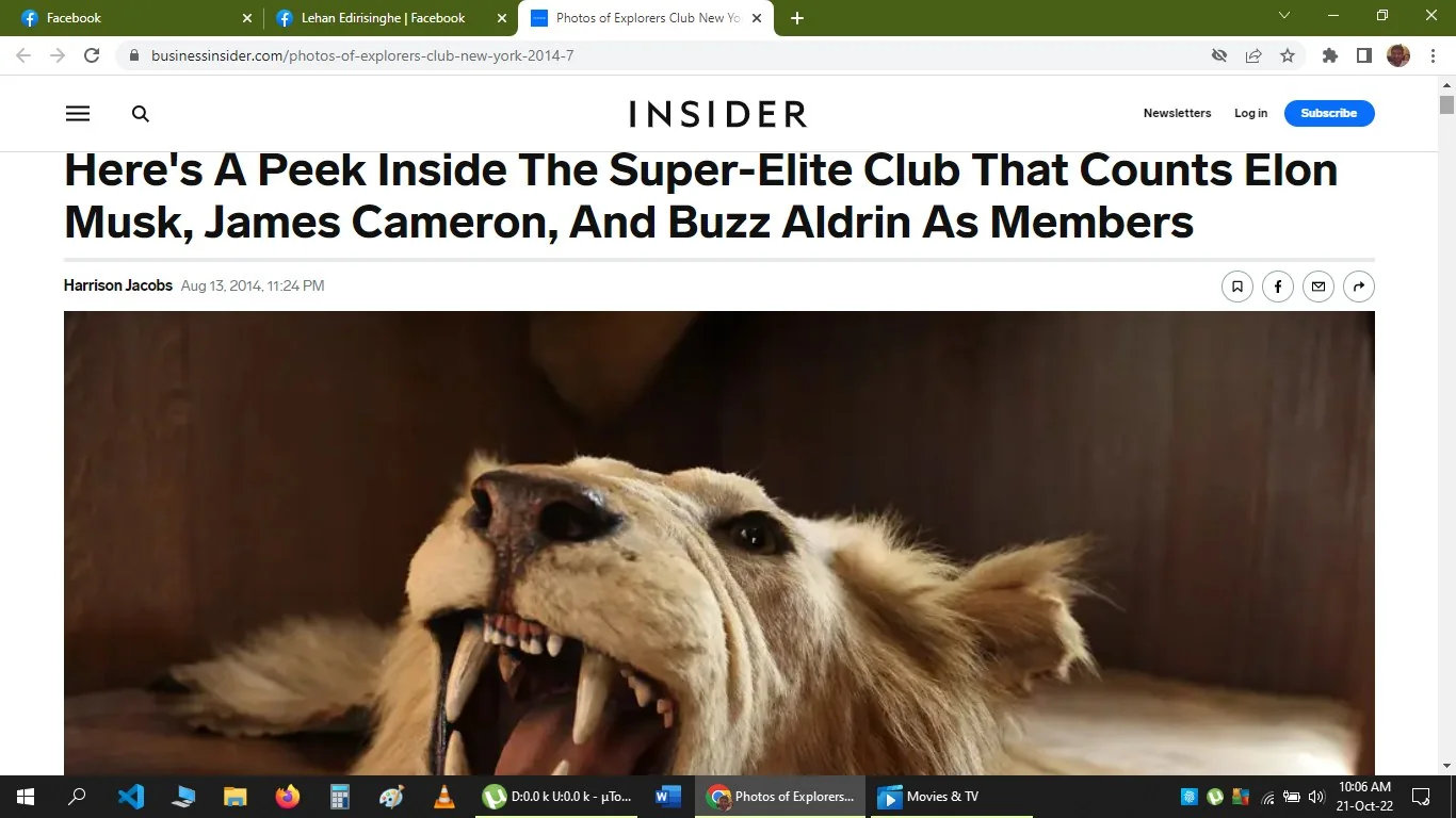 The screenshot captures an article from the website businessinsider.com, published by INSIDER. The title reads, "Here's A Peek Inside The Super-Elite Club That Counts Elon Musk, James Cameron, And Buzz Aldrin As Members," written by Harrison Jacobs on August 13, 2014. The focus of the article is on an exclusive club known for its famous members, including Elon Musk, James Cameron, and Buzz Aldrin. The image accompanying the article shows a taxidermy lion, which is prominently displayed against a wooden background, possibly symbolizing the club's adventurous or exploratory theme. The lighting is warm, highlighting the lion's detailed features like its open mouth and sharp teeth, giving a glimpse into the exotic or elite ambiance of the club. The interface shows typical web page elements, such as navigation options and social media icons for sharing the article.