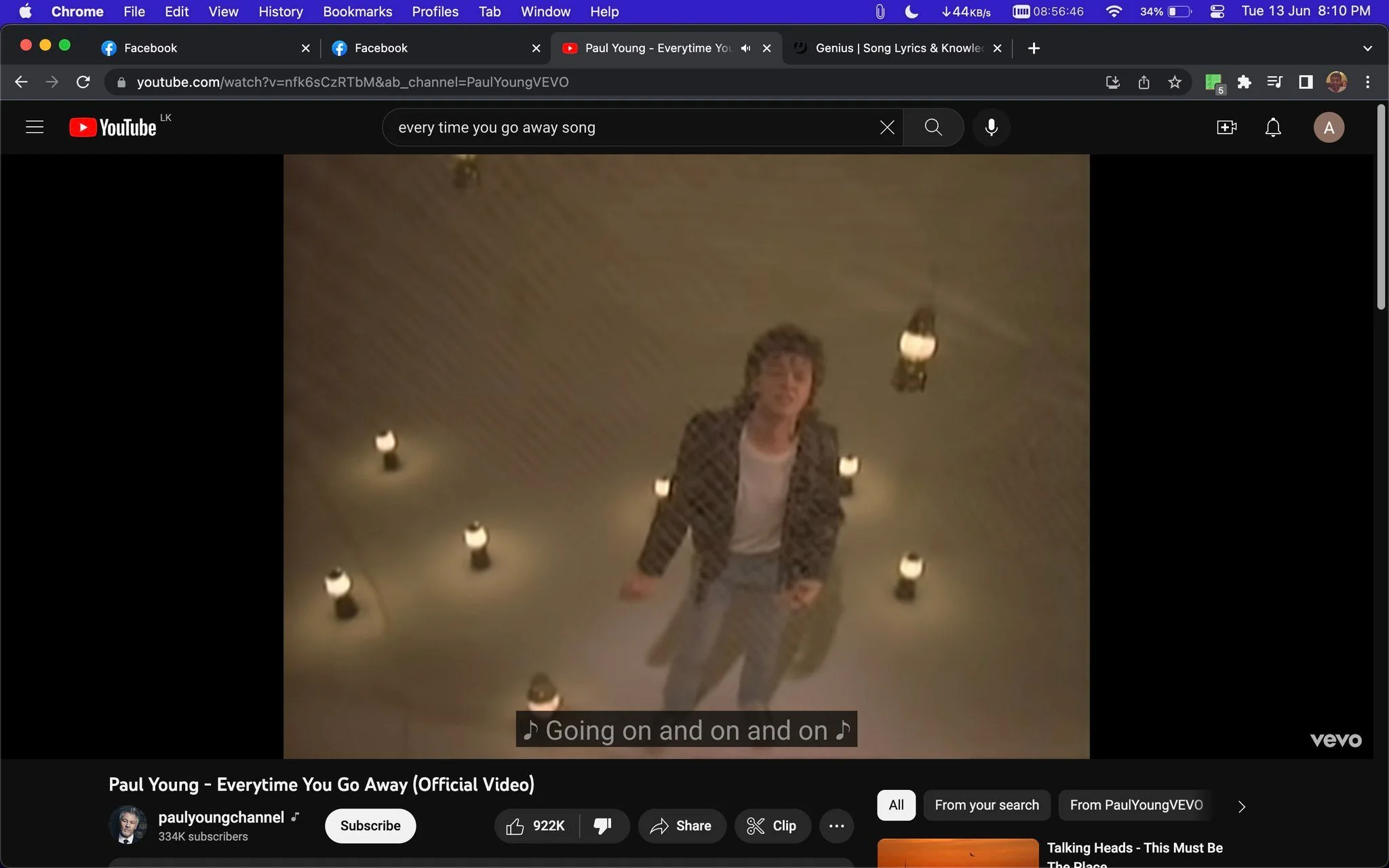 The image is a screenshot from the official music video for "Everytime You Go Away" by Paul Young on YouTube. The setting features Paul Young standing in a dimly lit space surrounded by small hanging lights, creating a dramatic atmosphere. The lighting casts soft shadows on the floor, enhancing the mood of the scene. Paul Young is wearing light blue jeans, a white shirt, and a dark jacket, embodying a casual yet stylish 1980s look. His posture is expressive, hinting at the emotional tone of the song. The subtitle at the bottom reads "Going on and on and on," indicating a line from the lyrics. The video is hosted on the "paulyoungchannel" with significant engagement, including likes and options to share or comment. Overall, the scene conveys a sense of introspection and longing, characteristic of the song's theme.
- Title: "Paul Young - Everytime You Go Away (Official Video)"
- Channel / profile: "paulyoungchannel"
- Site / app: "YouTube"
- Captions / subtitles: "Going on and on and on"
