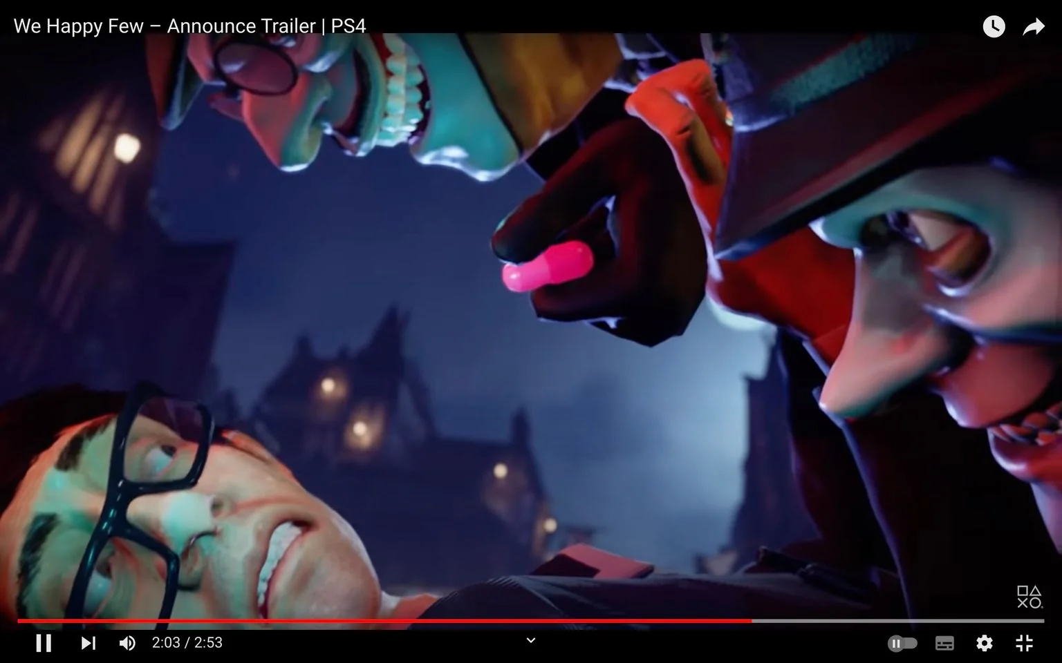 This image is a frame from the "We Happy Few – Announce Trailer" for the PS4, showcasing a dramatic scene at night. In the foreground, a character wearing glasses appears distressed, lying on the ground with a look of fear or anxiety. Above him, two other characters lean in closely. They have exaggerated facial features, with unnaturally wide grins and intense expressions, adding to the unsettling atmosphere. One character holds a bright pink object, possibly a pill, suggesting a theme of control or manipulation. The lighting is moody, casting deep shadows and highlighting the eerie, cartoonish style of the characters. The background shows a dimly lit town, reinforcing the tense and mysterious mood of the scene. The image is from a video game trailer, reflecting the game's distinctive artistic style and thematic elements of societal control.