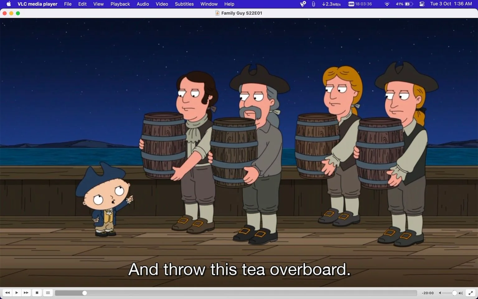 ```
The image is a screenshot from an episode of the animated series "Family Guy," specifically Season 22, Episode 1. It shows a scene set on a ship at night, with a starry sky in the background. In the foreground, Stewie Griffin, a character from the show, is dressed in historical attire, resembling a colonial-era outfit with a blue tricorn hat. He is gesturing with his hand and appears to be giving instructions.
Alongside Stewie, several other characters are depicted holding barrels, suggestive of a historical reenactment of the Boston Tea Party. They are dressed in similar colonial attire, including vests, knee-high socks, and shoes with buckles. The men look attentive as they stand on the deck, ready to follow Stewie's orders. The caption at the bottom of the screen reads, "And throw this tea overboard," hinting at the historical reference. The visual composition emphasizes the comedic and anachronistic style typical of "Family Guy," with its vibrant colors and distinct character designs. The interface of VLC media player is visible, indicating that the episode is being viewed on a digital platform.