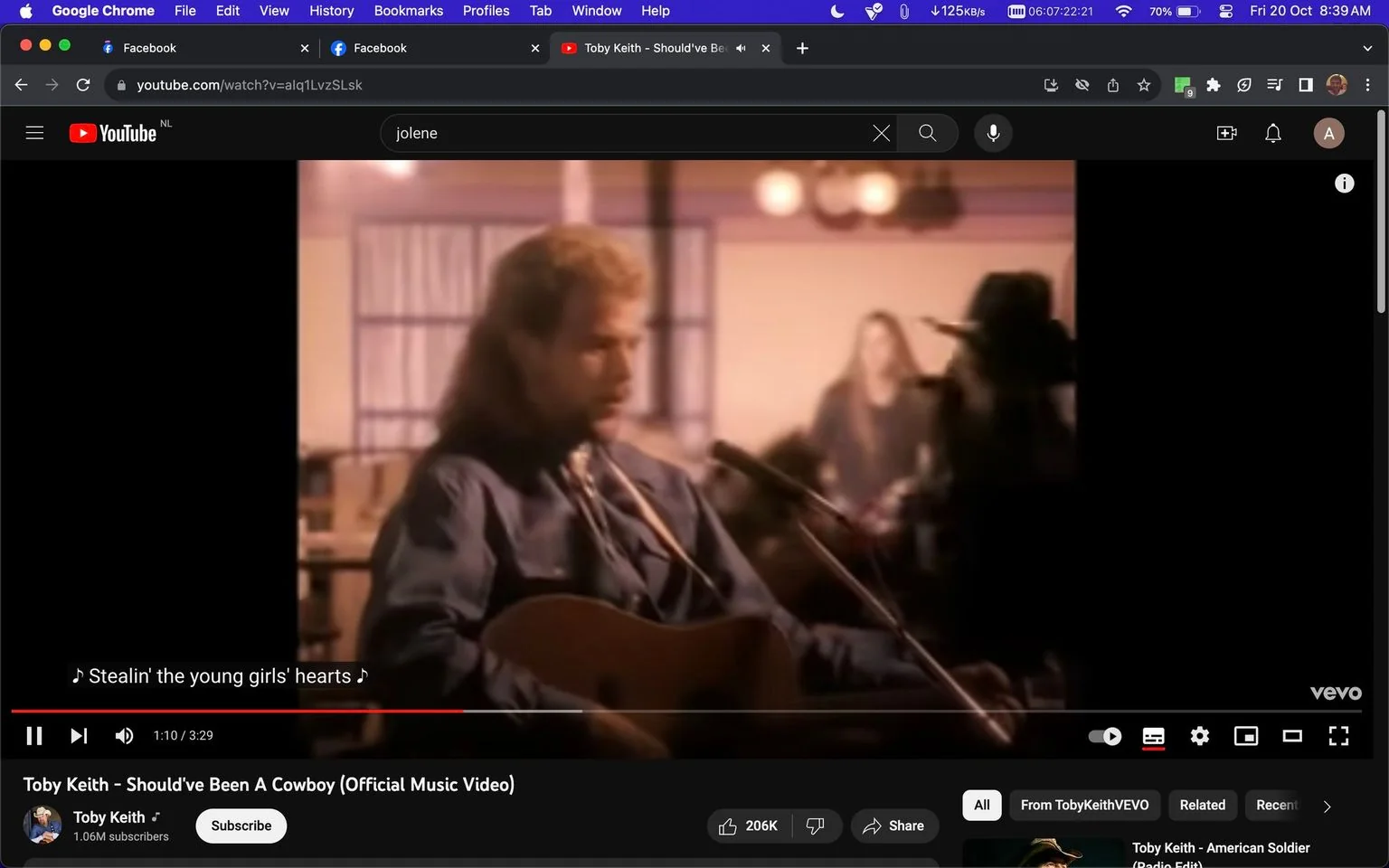 The image is a frame from the official music video for "Should've Been A Cowboy" by Toby Keith, visible on YouTube. Toby Keith, seen in focus, is playing a guitar. He is dressed in a casual denim shirt, embodying a classic country style. The setting is a warm, inviting indoor space, likely a bar or a small venue, as suggested by the lighting and background decor. The background is slightly blurred, emphasizing Toby Keith as the focal point. Subtitles on the screen read "Stealin' the young girls' hearts," reflecting the lyrics being sung at this moment. The video is hosted on his official channel on YouTube, with the interface showing typical playback controls, and viewer engagement details such as likes and shares are present. The overall mood is nostalgic, matching the song's themes of cowboy life and adventure.
- Title: "Toby Keith – Should’ve Been A Cowboy (Official Music Video)"
- Channel / profile: "Toby Keith"
- Site / app: "YouTube"
- Captions / subtitles: "Stealin' the young girls' hearts"
