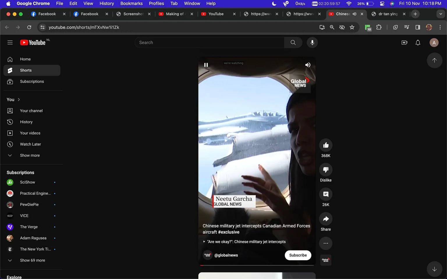 The image is a screenshot from YouTube, depicting a video from Global News. The video is part of YouTube Shorts and features Neetu Garcha, who appears to be inside an aircraft. She is positioned near a window, pointing outside where a military jet is visible. The scene indicates a reportage setting, likely capturing the moment a Chinese military jet intercepted a Canadian Armed Forces aircraft. The lighting is natural, streaming through the window, and highlights the contrast between the interior of the aircraft and the sky outside.
In the foreground, Neetu Garcha's expression is serious, fitting the context of the event being discussed. She is facing the camera, gesturing towards the window, indicating the presence of the jet outside. The Global News logo is visible at the top right, reinforcing the source of the content. Text on the screen provides context, with a caption reading “Chinese military jet intercepts Canadian Armed Forces aircraft #exclusive,” suggesting a serious news event. The interface includes standard YouTube features such as like and dislike buttons, alongside the video title and subscription prompt for @globalnews.