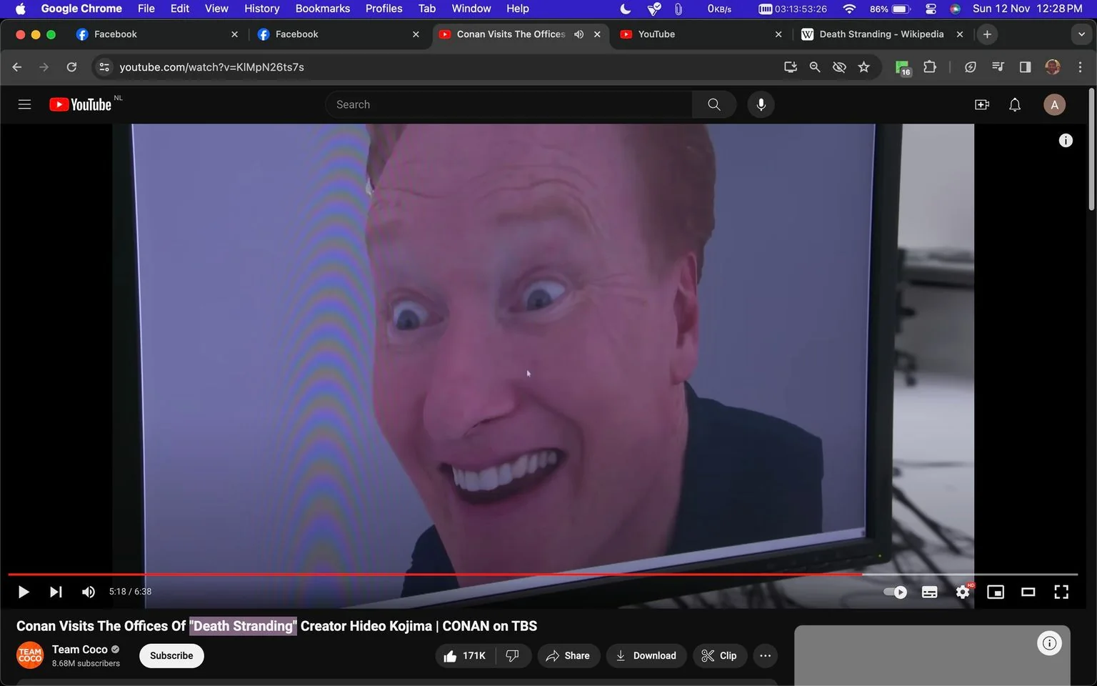 The image is a screenshot from a YouTube video titled "Conan Visits The Offices Of 'Death Stranding' Creator Hideo Kojima | CONAN on TBS," hosted on the Team Coco channel. The scene prominently features a close-up image on a screen showing Conan, with an exaggeratedly wide-eyed and humorous expression. This screen is part of a video visit to the office of Hideo Kojima, the creator of the game "Death Stranding." The setting appears to be indoors, likely in a television studio or office environment. The framing focuses on Conan's face, capturing a playful and comedic moment typical of his style.
The YouTube interface is visible, with the title and channel information displayed below the video frame. The browser tabs at the top, such as Facebook and Wikipedia, are also visible, indicating that this is a screengrab from a computer. The video has garnered significant attention, as indicated by the subscriber count and engagement metrics. The overall mood conveyed is light-hearted and entertaining, reflecting Conan's comedic brand.
- Title: "Conan Visits The Offices Of 'Death Stranding' Creator Hideo Kojima | CONAN on TBS"
- Channel / profile: "Team Coco"
- Site / app: "YouTube"
