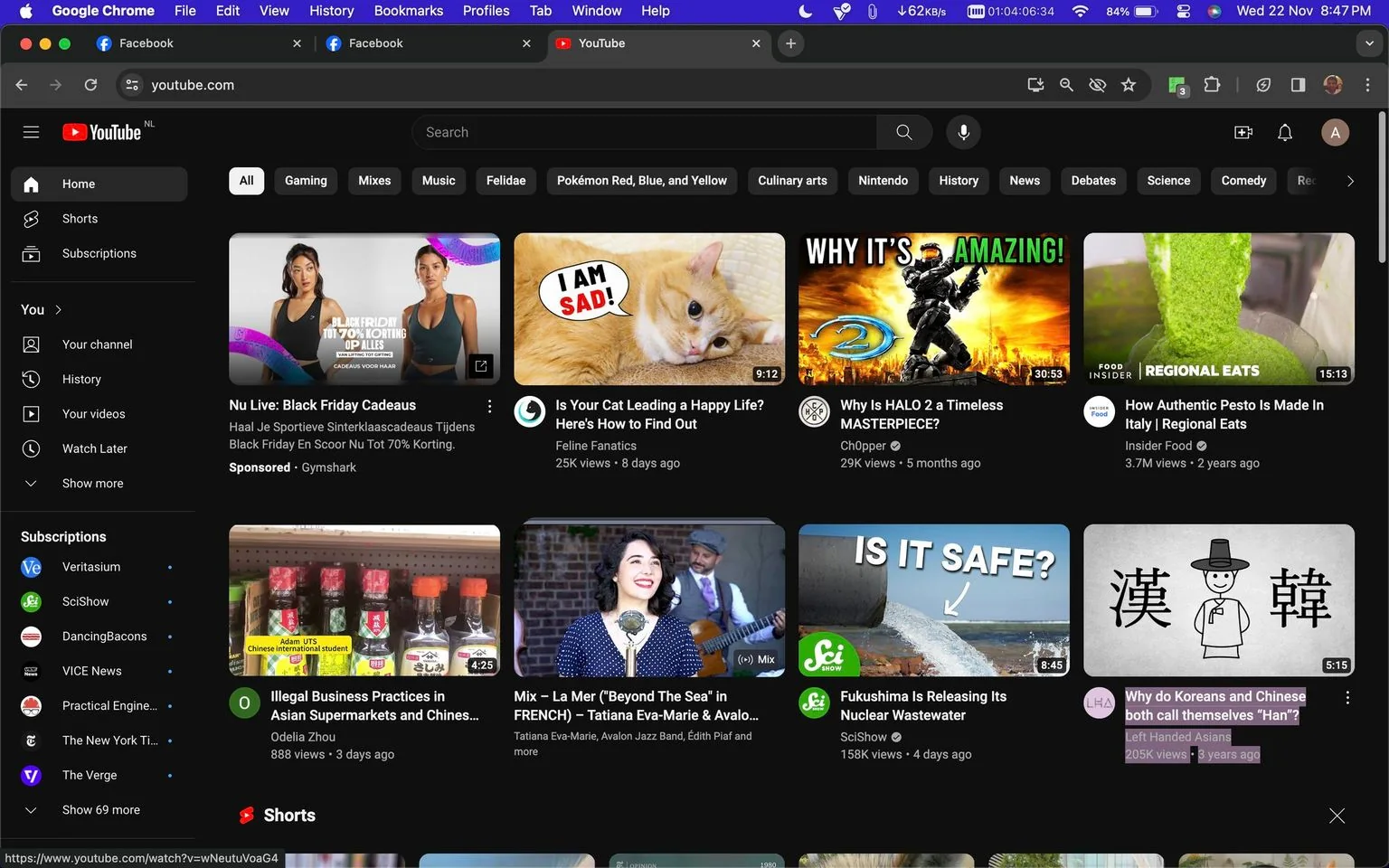 This image is a screenshot of the YouTube homepage in dark mode. The top navigation bar includes open tabs for YouTube and Facebook, as well as an active internet connection indicator. The main section displays various video thumbnails with titles, views, and channel names. In the top left corner, a sponsored video from Gymshark titled "Nu Live: Black Friday Cadeaus" is featured, showcasing two women in athletic wear. Next to it, a thumbnail for a video by "Feline Fanatics" titled "Is Your Cat Leading a Happy Life? Here's How to Find Out" features an image of a sad-looking cat.
To the right is a video by "Ch0pper," titled "Why Is HALO 2 a Timeless MASTERPIECE?" featuring a dynamic, action-packed thumbnail related to the game HALO 2. Another video by "Insider Food" titled "How Authentic Pesto Is Made In Italy | Regional Eats" shows a close-up of pesto being prepared. The channel "SciShow" offers a video on nuclear wastewater from Fukushima, and "Left Handed Asians" presents a video discussing cultural identity. The sidebar lists subscribed channels like "Veritasium" and "SciShow." The overall mood is informative and neatly organized, with a focus on varied content from gaming to cultural discussions.
- Title: "Why Is HALO 2 a Timeless MASTERPIECE?"
- Channel / profile: "Ch0pper"
- Site / app: "YouTube"