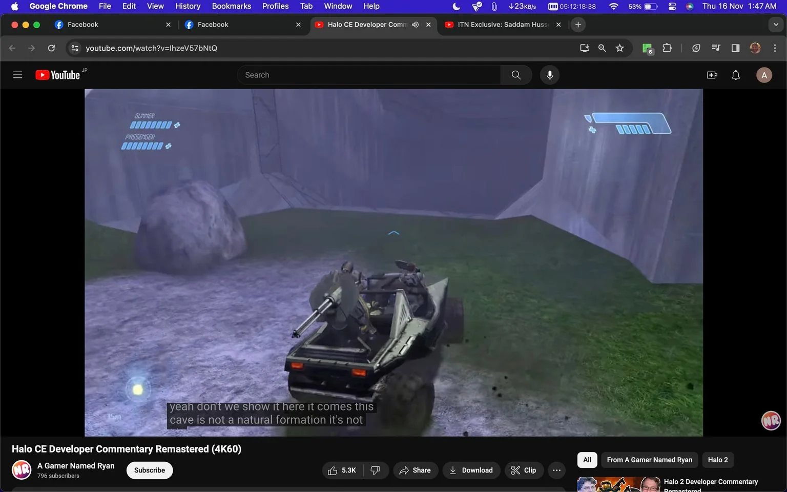 The screenshot shows a YouTube video titled "Halo CE Developer Commentary Remastered (4K60)" on the channel "A Gamer Named Ryan." The video is part of a commentary series on the game "Halo." The scene captures gameplay, featuring a vehicle known as a Warthog, which is driving through a rocky, outdoor environment. Two characters are visible in the Warthog, with one operating a mounted gun. The environment is lush with grass and enclosed by high rock walls. The screen displays HUD elements showing health indicators labeled "GUNNER" and "PASSENGER." The lighting in the scene is subdued, creating a slightly misty atmosphere. Subtitles at the bottom of the screen read, "yeah don't we show it here it comes this cave is not a natural formation it's not," indicating an audio commentary track is playing. The browser tabs at the top show the user is also browsing Facebook and another YouTube video titled "ITN Exclusive: Saddam Hussain."