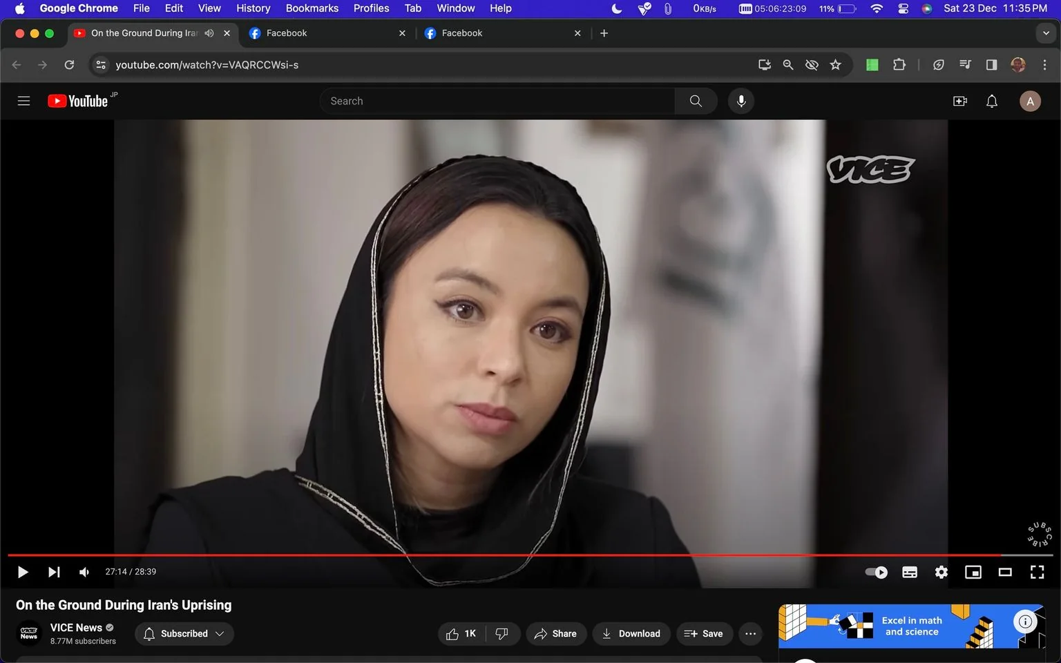 The image is a screenshot from a YouTube video titled "On the Ground During Iran's Uprising," produced by VICE News. It shows a woman in an indoor setting, likely during an interview. She is wearing a black headscarf with a silver lining, covering her head and shoulders, which suggests a formal or traditional context. Her expression is serious and attentive, indicating engagement in a meaningful conversation. The background is softly blurred, focusing the viewer’s attention on her. The VICE logo is visible in the top right corner, reinforcing the branding. The device's interface shows it’s paused at timestamp 27:14 of a 28:39-minute video. The screenshot includes various controls and options typical of a YouTube player interface, like play, share, and download buttons, along with viewer ratings and subscription information. The setting is well-lit, with an emphasis on natural tones, adding to the gravity of the interview's subject matter.
- Title: "On the Ground During Iran's Uprising"
- Channel / profile: "VICE News"
- Site / app: "YouTube"