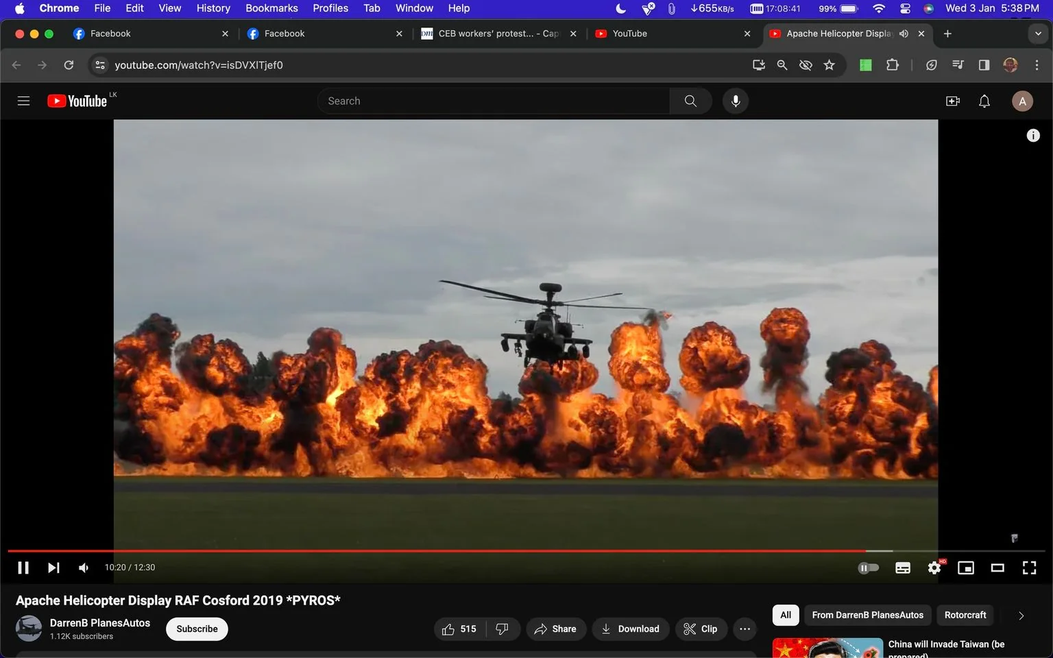 This image is a screenshot from a YouTube video titled "Apache Helicopter Display RAF Cosford 2019 *PYROS*," uploaded by the channel "DarrenB PlanesAutos." The scene shows a dramatic moment during an airshow, featuring a military helicopter, likely an Apache, hovering in the air. Below the helicopter, a series of large explosions light up the scene, creating a dramatic backdrop of intense orange flames and thick smoke. The sky is overcast, adding to the dramatic effect of the scene, and the helicopter is centrally positioned, emphasizing its role in the display. The landscape is flat, suggesting an airfield setting appropriate for an airshow or military demonstration. The image captures the dynamic and intense nature of such displays, highlighting both the power of the machinery and the spectacle of the explosion effects. The interface elements at the top of the image reveal that it's taken from a browser, with various tabs open, indicating a typical user experience of browsing online content.
- Title: "Apache Helicopter Display RAF Cosford 2019 *PYROS*"
- Channel / profile: "DarrenB PlanesAutos"
- Site / app: "YouTube"