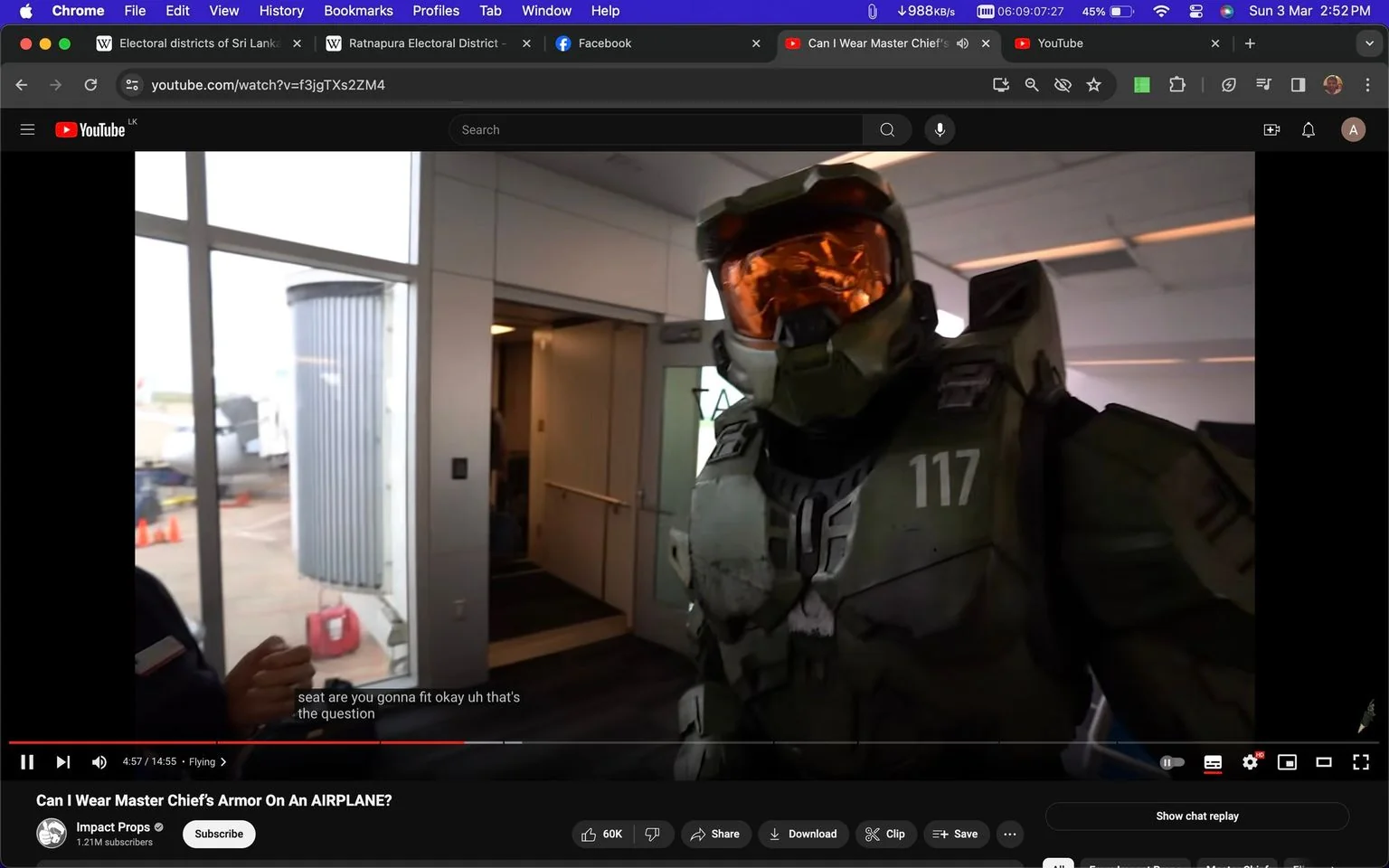 The image is a screenshot from a YouTube video titled "Can I Wear Master Chief's Armor On An AIRPLANE?" by the channel Impact Props. It shows an individual wearing a detailed and realistic suit of armor, resembling Master Chief from the "Halo" video game series. The armor is green with a visible number "117" on the chest, indicating the character's designation. The person is standing inside an airport, near a boarding gate. The background shows the interior of the airport with windows revealing the tarmac outside.
The lighting is typical of an indoor airport setting, bright and evenly distributed. The armor has a worn, battle-worn look with scratches and weathering for realism. The helmet has an orange visor, adding to the authenticity of the cosplay. The person wearing the armor is interacting with someone, potentially discussing travel logistics as indicated by the subtitles that mention fitting into a seat. The scene captures the curiosity and challenges of wearing such an elaborate costume in a public setting like an airport.
- Title: "Can I Wear Master Chief's Armor On An AIRPLANE?"
- Channel / profile: "Impact Props"
- Site / app: "YouTube"
- Captions / subtitles: "seat are you gonna fit okay uh that's the question"