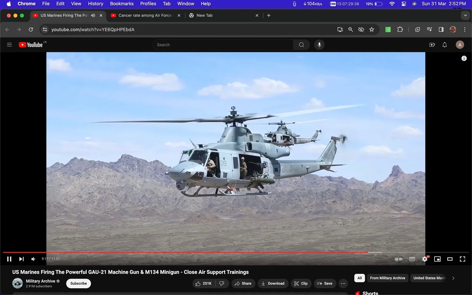 ```
**SECTION 2: Rich Prose**
The image is a screenshot from a YouTube video titled "US Marines Firing The Powerful GAU-21 Machine Gun & M134 Minigun - Close Air Support Trainings," featured on the Military Archive channel. The scene captures two helicopters flying over a rugged desert landscape with mountains in the background on a clear day. These helicopters appear to be military aircraft, likely used for training exercises in close air support. Visible on the side of the leading helicopter is the text "US MARINES," indicating the involvement of the United States Marine Corps.
In the foreground, armed personnel can be seen inside the helicopter, poised for action, suggesting a training or tactical exercise. The helicopters are painted in a muted military gray, blending with the arid environment below. The overall composition highlights the precision and readiness of military operations, with the landscape providing a stark and expansive backdrop. The video implies a focus on advanced weaponry and tactical training, showcasing tools such as the GAU-21 Machine Gun and the M134 Minigun. The lighting is bright and natural, emphasizing the details of the helicopters against the sky.
- Title: "US Marines Firing The Powerful GAU-21 Machine Gun & M134 Minigun - Close Air Support Trainings"
- Channel / profile: "Military Archive"
- Site / app: "YouTube"