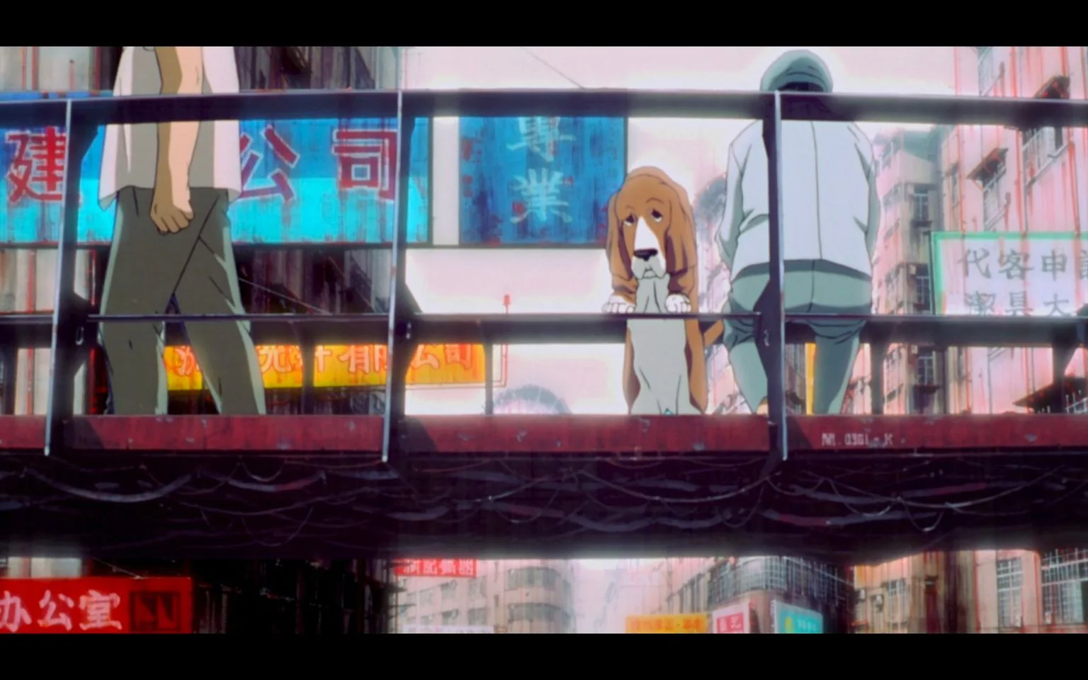 An animated scene from the work "Basket Hound" depicts a bustling urban setting. In the foreground, a dog with droopy ears, presumably the Basket Hound, stands on a pedestrian bridge, gazing contemplatively at the scene below. Beside the dog, a person is crouched, wearing casual attire with a hoodie, facing away from the viewer. Another person walks past, only partially visible, in a t-shirt and pants. The background is filled with numerous vibrant signs featuring Asian characters, creating a sense of a busy cityscape. The light is bright, suggesting daytime, and the color palette favors warm tones with hints of neon. The animation style is detailed, capturing the essence of a lively urban environment.