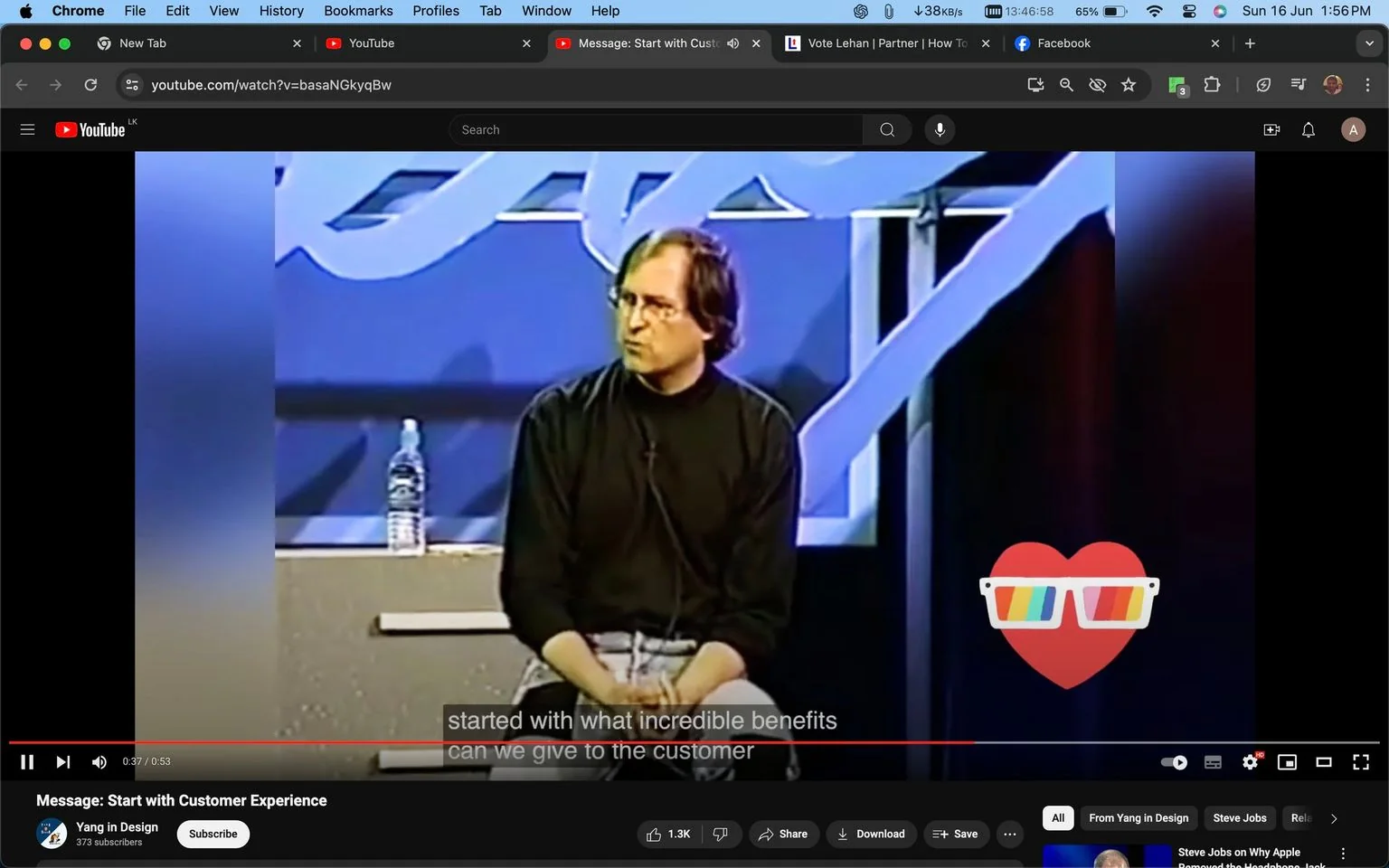 The image is a YouTube video screenshot featuring a presentation titled "Message: Start with Customer Experience" on the "Yang in Design" channel. The scene shows Steve Jobs seated on a stage, dressed in a black turtleneck and jeans, a typical attire associated with him. He appears to be engaged in delivering a talk or presentation, likely discussing customer-focused design principles. A plastic water bottle is placed beside him on the stage. The background includes large, abstract blue designs, contributing to a corporate or tech conference environment. The lighting is moderate, focusing on Steve Jobs, while the rest of the stage is dimly lit. Captions at the bottom of the screen read "started with what incredible benefits" and "can we give to the customer," indicating a focus on customer benefits in his speech. A heart icon with colorful sunglasses is overlaid on the right side, adding a playful visual element to the otherwise formal setting.