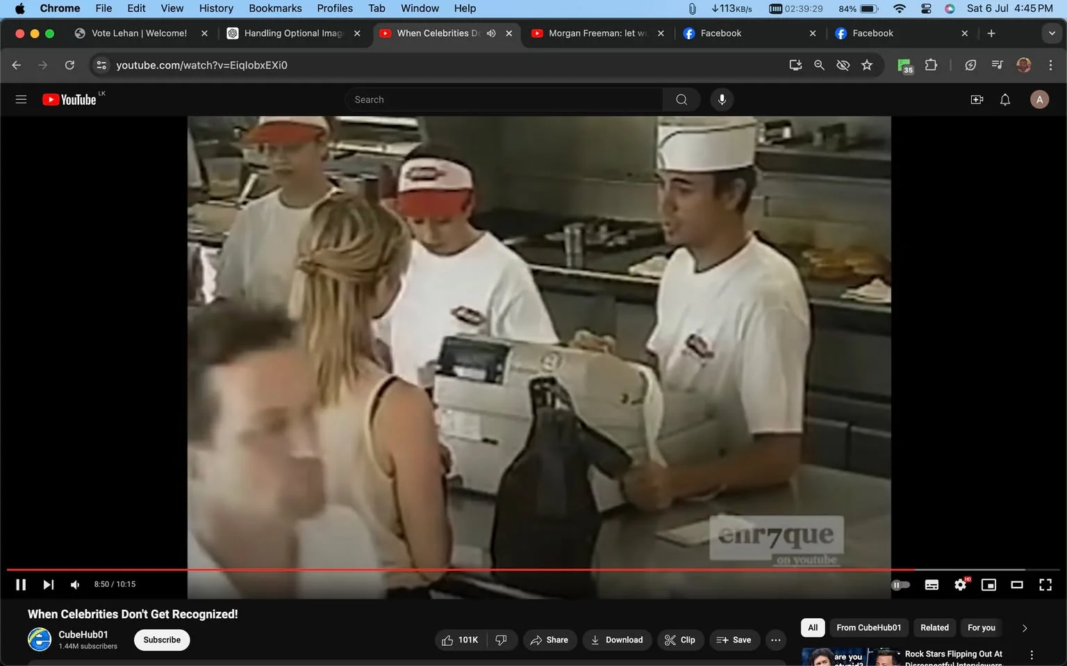 Enrique Iglesias is depicted working at what appears to be a fast food restaurant counter. He is wearing a white uniform with a cap, common attire for fast food employees. The setting is indoors, with a typical fast food restaurant atmosphere: a counter, cash register, and busy background with other employees. In front of the counter, there is a woman with blonde hair, wearing a sleeveless top, appearing to place an order or have a conversation with Enrique Iglesias. The lighting is bright and consistent with a restaurant environment. The image captures a candid moment where Enrique Iglesias is interacting with a customer, possibly as part of a segment or a humorous scenario where celebrities are unrecognized in everyday roles. The screenshot is from a YouTube video titled "When Celebrities Don't Get Recognized!" from the channel CubeHub01. There is a watermark on the image reading "enr7que on youtube," adding to the context of the video’s theme.
- Title: "When Celebrities Don't Get Recognized!"
- Channel / profile: "CubeHub01"
- Site / app: "YouTube"