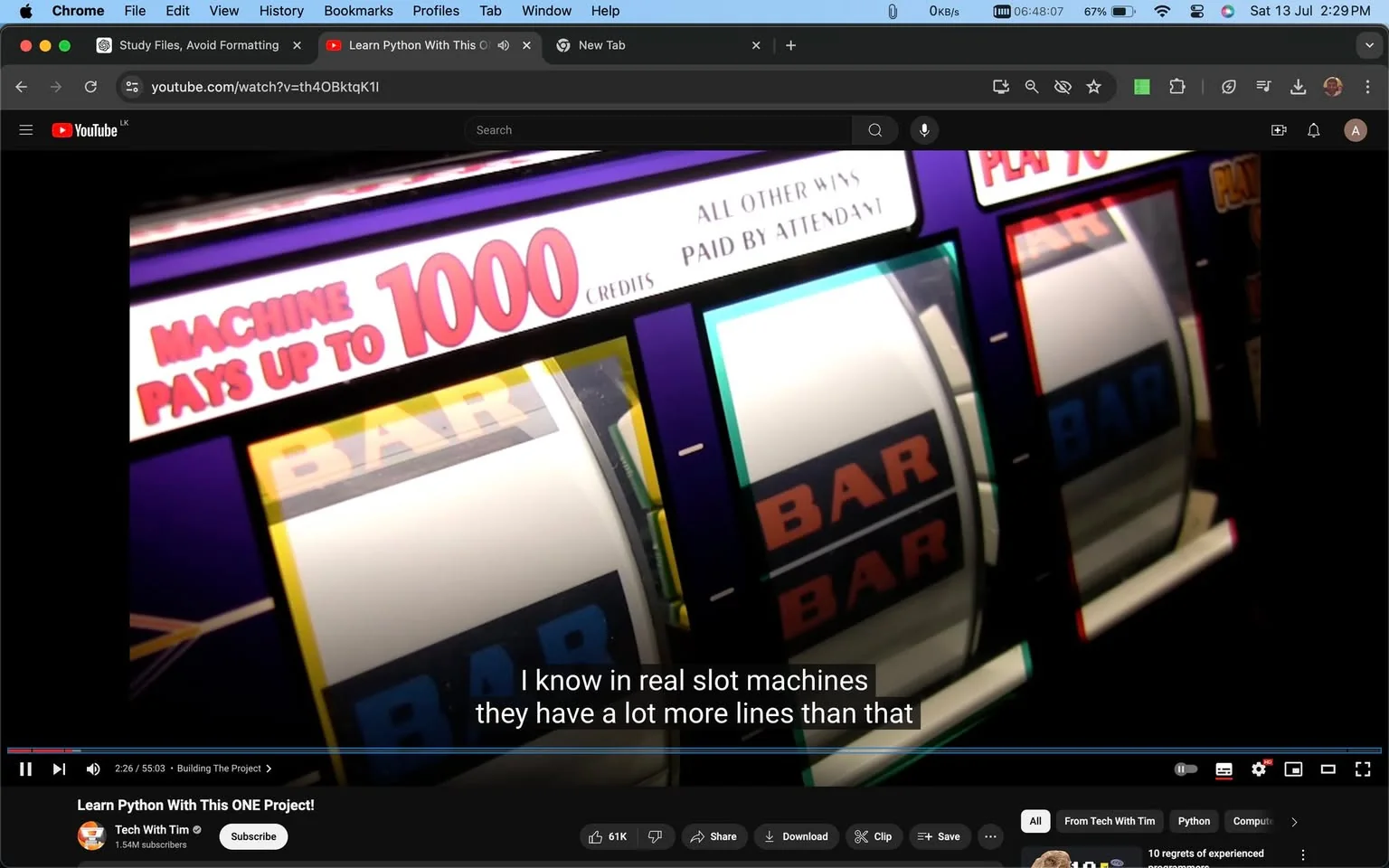 The image is a screenshot from a YouTube video titled "Learn Python With This ONE Project!" by the channel "Tech With Tim." The video frame shows a close-up of a slot machine with visible symbols and text. The text above the slot machine reels reads "MACHINE PAYS UP TO 1000" and "ALL OTHER WINS PAID BY ATTENDANT." The slot machine displays the word "BAR" across its reels, indicating typical slot machine symbols.
The scene is brightly lit, emphasizing the colorful and vibrant design of the slot machine, which has a classic arcade style. The video likely discusses programming a slot machine as a project using Python, as suggested by the title and visible text. The caption in the frame mentions the complexity of real slot machines compared to simpler versions. The browser interface is visible at the top, showing the video is playing on YouTube, with standard controls and tabs displayed.
