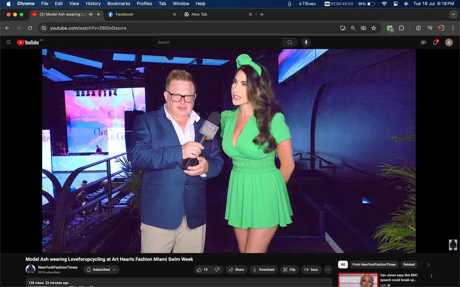 In this YouTube screenshot, Peter Ronan from Fashion Times is conducting an interview at the Art Hearts Fashion Miami Swim Week. Peter Ronan, holding a microphone labeled "NY Times," is dressed in a navy blue blazer over a white shirt, paired with beige trousers. He appears to be engaging in conversation with a woman in a bright green dress. Her outfit includes a matching headband, complementing her long, wavy hair. The setting is indoors, possibly a backstage area, with dim lighting enhancing the atmosphere of a fashion event. In the background, a stage with large screens displaying colorful visuals is visible, indicating the lively environment typical of fashion shows. The video is titled "Model Ash wearing Loveforupcycling at Art Hearts Fashion Miami Swim Week" and is hosted on the NewYorkFashionTimes channel.
- Title: "Model Ash wearing Loveforupcycling at Art Hearts Fashion Miami Swim Week"
- Channel / profile: "NewYorkFashionTimes"
- Site / app: "YouTube"
