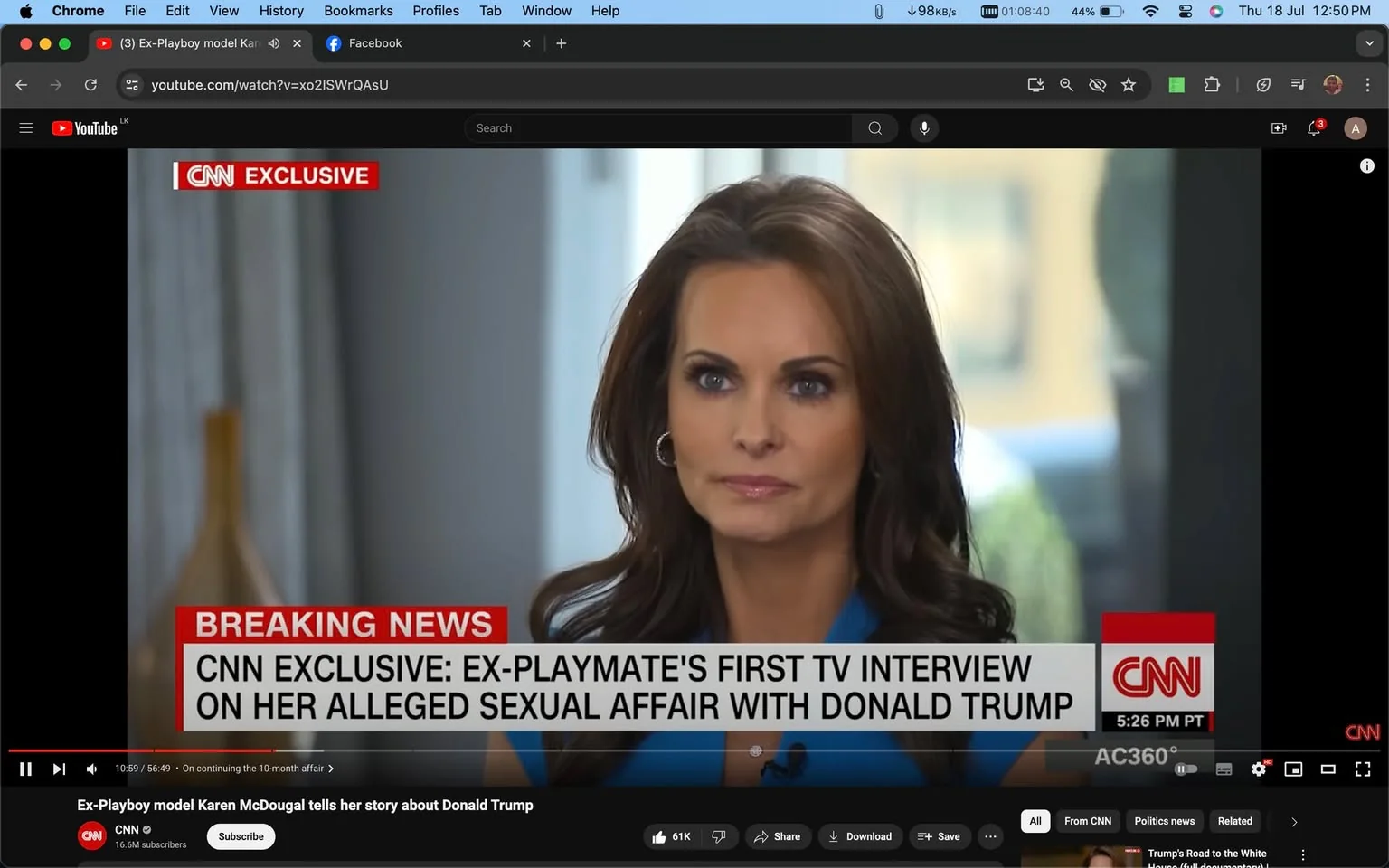 The image is a screenshot from a YouTube video featuring an interview with Karen McDougal, as indicated by the hint provided. The setting is an indoor television interview conducted by CNN, as seen from the "CNN EXCLUSIVE" and "BREAKING NEWS" banners on the screen. Karen McDougal is positioned prominently in the center, dressed in a blue outfit, and is looking attentively towards the interviewer, suggesting a serious and focused mood. The lighting is bright, highlighting her facial features, and the background is softly blurred, putting emphasis on her. The on-screen text announces the nature of the interview: "EX-PLAYMATE'S FIRST TV INTERVIEW ON HER ALLEGED SEXUAL AFFAIR WITH DONALD TRUMP." This headline, along with the visible CNN logo, confirms the context and the network broadcasting the interview. The video is titled "Ex-Playboy model Karen McDougal tells her story about Donald Trump," and it is published by the CNN channel on YouTube.