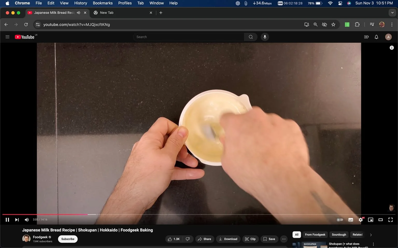 The screenshot captures a moment from a YouTube video titled "Japanese Milk Bread Recipe | Shokupan | Hokkaido | Foodgeek Baking" by the channel Foodgeek, which has 154K subscribers. In this scene, hands are seen vigorously stirring a mixture in a white bowl, likely as part of the recipe preparation. The setting appears to be a kitchen, characterized by a dark countertop that provides a contrasting backdrop to the pale mixture in the bowl. The lighting is bright and even, highlighting the action taking place.
The image conveys an instructional and engaging mood, typical of cooking tutorials. The video likely aims to teach viewers how to make a specific type of milk bread known as Shokupan, which is popular in Japanese cuisine. The focus on the mixing action suggests a step-by-step approach in the culinary process. The clean and organized setting, along with the precise actions, implies a well-prepared and educational content style.
- Title: "Japanese Milk Bread Recipe | Shokupan | Hokkaido | Foodgeek Baking"
- Channel / profile: "Foodgeek"
- Site / app: "YouTube"