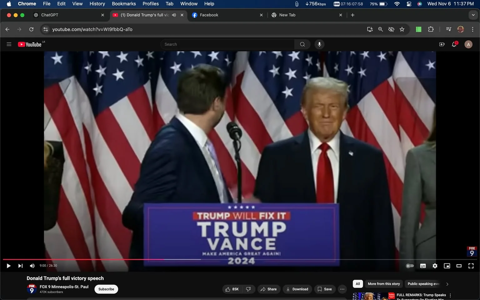 1) Rich description: The image is a screenshot from a YouTube video titled "Donald Trump's full victory speech," published by FOX 9 Minneapolis-St. Paul. In the center, a man is at a podium with a sign reading "TRUMP WILL FIX IT TRUMP VANCE MAKE AMERICA GREAT AGAIN 2024." Behind him is Donald Trump, who is smiling slightly and wearing a dark suit with a white shirt and red tie. The background is adorned with several American flags, adding to the political atmosphere of the scene. The setting appears to be a formal indoor event, likely a political rally or speech. The mood is serious yet celebratory, fitting for a victory speech. The lighting is bright and professional, highlighting the individuals and emphasizing the patriotic theme.
2) On-screen text block:
- Title: "Donald Trump's full victory speech"
- Channel / profile: "FOX 9 Minneapolis-St. Paul"
- Site / app: "YouTube"