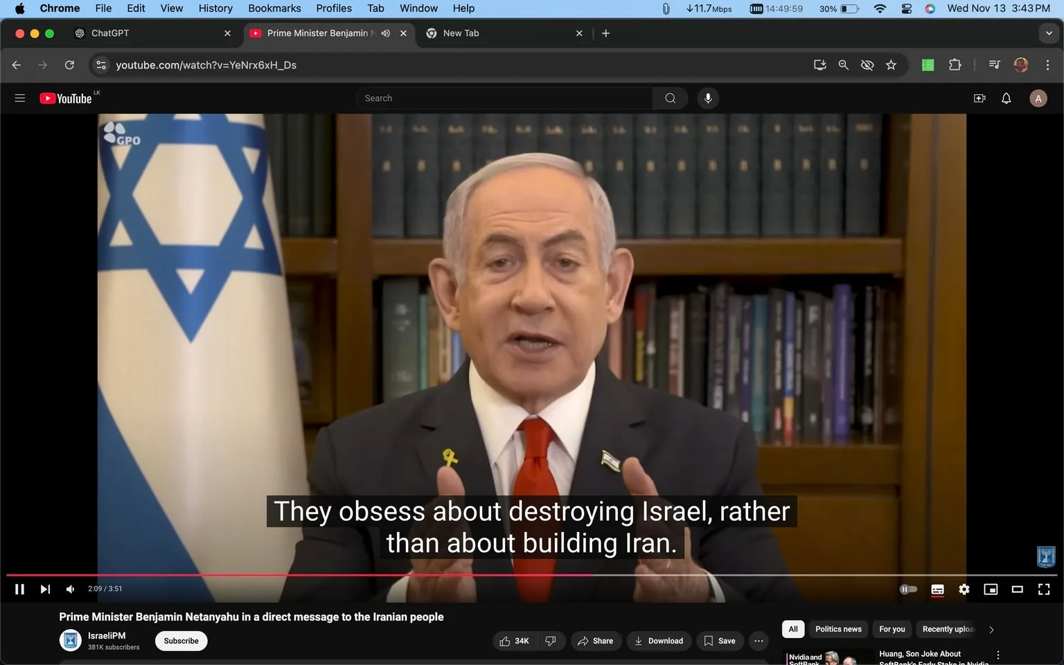 Benjamin Netanyahu is featured in this YouTube screenshot, delivering a speech or message. The scene is set indoors, likely in an office or library, as suggested by the bookshelf filled with books in the background. Benjamin Netanyahu is wearing a dark suit, a white shirt, and a red tie, displaying a formal and authoritative appearance. His posture is composed and he seems engaged in delivering a statement, supported by his hand gestures. The Israeli flag is visible to his side, reinforcing the political context of the message.
The screenshot includes a subtitle that reads, “They obsess about destroying Israel, rather than about building Iran.” This suggests the topic involves geopolitical tensions or challenges. The scene conveys a serious and diplomatic tone, typical of political addresses.
The YouTube channel is named “IsraeliPM,” and the title of the video is prominently displayed as "Prime Minister Benjamin Netanyahu in a direct message to the Iranian people." This indicates the video’s target audience and the nature of the message.
- Title: "Prime Minister Benjamin Netanyahu in a direct message to the Iranian people"
- Channel / profile: "IsraeliPM"
- Site / app: "YouTube"
- Captions / subtitles: "They obsess about destroying Israel, rather than about building Iran."