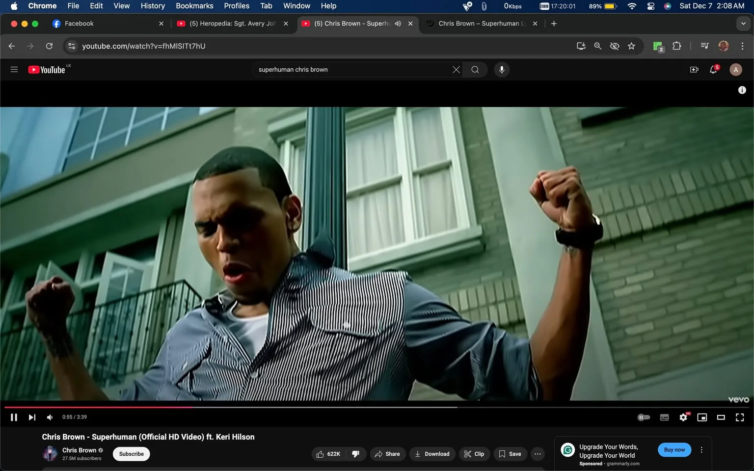 In this vibrant video frame from YouTube, the scene captures an energetic moment from the official music video for "Superhuman" by Chris Brown featuring Keri Hilson. The setting is outdoors, in front of a building with large windows, suggesting an urban environment. Chris Brown is in the foreground, dynamically posed with one arm raised and a determined expression on his face, embodying the song's powerful and uplifting theme. He is dressed in a striped button-down shirt over a white T-shirt, exuding a casual and stylish vibe. The lighting is bright, enhancing the vividness of the scene and lending a sense of vitality. The video's visual style is polished, typical of high-definition music videos, emphasizing both the artist's performance and the urban backdrop. The interface shows typical YouTube elements, including the video title, channel name, view count, and interaction buttons. This frame highlights the video's focus on personal strength and emotional intensity, reinforced by Chris Brown's expressive performance. 

- Title: "Chris Brown - Superhuman (Official HD Video) ft. Keri Hilson"
- Channel / profile: "Chris Brown"
- Site / app: "YouTube"