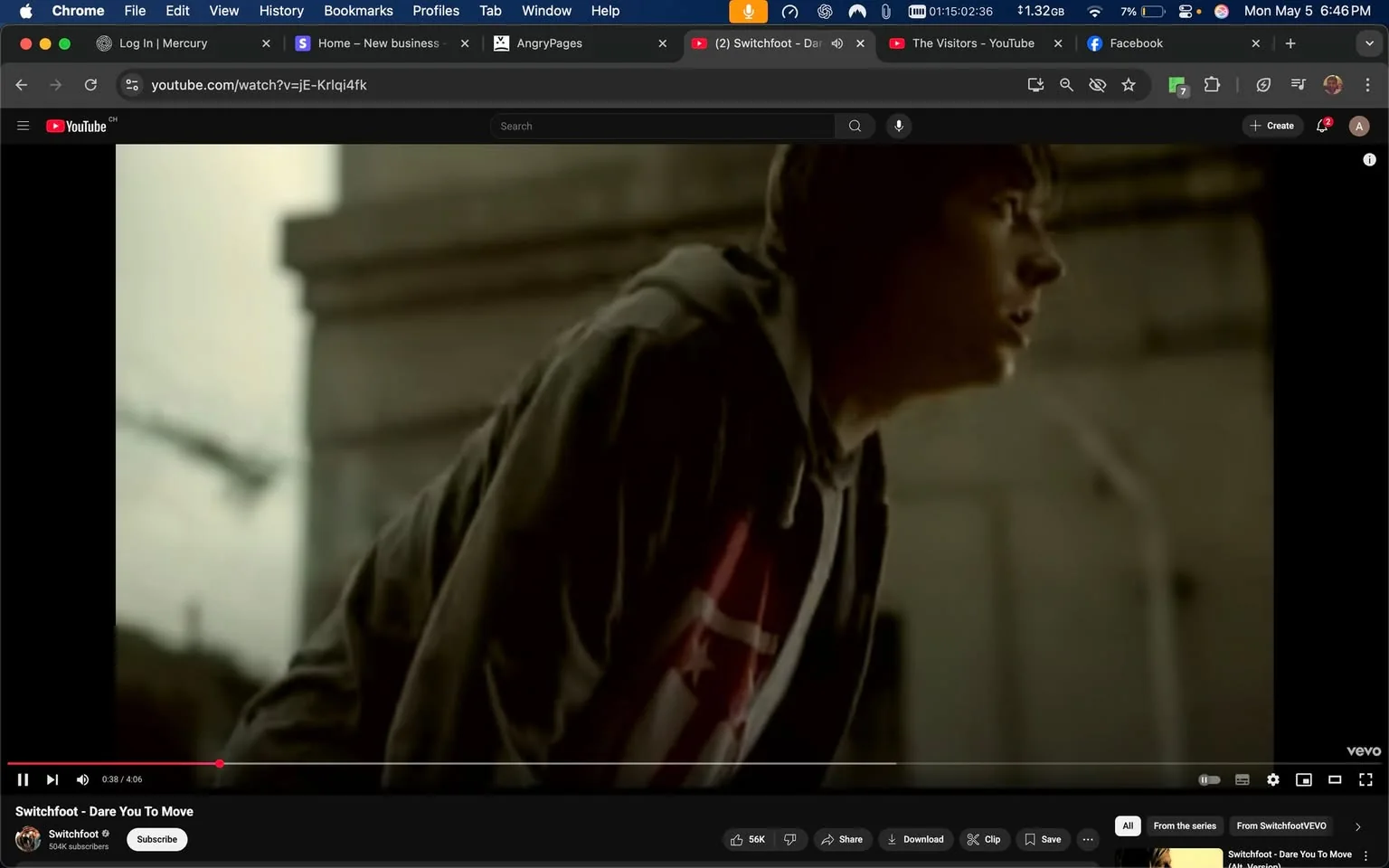 The image shows a scene from a video on YouTube, specifically from a music video titled "Dare You To Move" by the band Switchfoot. The video is currently playing, with a timestamp indicating 38 seconds into the 4-minute and 6-second duration.

In the foreground, a young male figure is prominently featured. He has short, dark hair and is positioned in a slightly crouched stance, suggesting a moment of tension or anticipation. His facial expression appears serious, with his mouth slightly open as if he is about to speak or react to something. The lighting in the scene is somewhat muted, creating a dramatic atmosphere.

The individual is wearing a gray hoodie, which has a loose fit and is partially unzipped. Underneath the hoodie, he has on a t-shirt that features a prominent red and white design, which includes a star and possibly a logo or emblem, although the details are not fully visible. The background is blurred but suggests an urban environment, with indistinct structures that could be buildings or walls, contributing to the overall mood of the scene.

The video player interface is visible at the bottom of the image, displaying the play/pause button, volume control, and options to share or download the video. The YouTube logo is present in the bottom right corner, indicating the platform where the video is hosted.

Overall, the image captures a moment of intensity within a music video, focusing on the character's expression and the atmospheric setting.