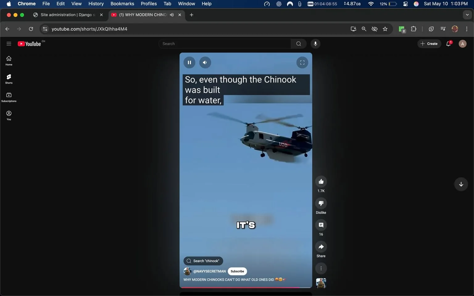 The image displays a screenshot from a YouTube Shorts video. The video features a helicopter, specifically a Chinook, flying against a clear blue sky. The helicopter is predominantly gray with some black accents and has the letters "USD" visible on its side. The rotor blades are in motion, creating a dynamic appearance as it hovers.

In the upper portion of the image, there is text that reads: "So, even though the Chinook was built for water," indicating that the video likely discusses the capabilities or features of the Chinook helicopter. Below this text, there is a large, bold word that says "IT'S," suggesting that the video may continue with an explanation or statement following this phrase.

On the left side of the image, there are various user interface elements typical of YouTube Shorts, including a play button, a volume control, and options for liking, disliking, and sharing the video. The like count is displayed as "1.7K," indicating that the video has received a significant number of likes.

The background of the image is dark, likely representing the YouTube interface, which contrasts with the bright blue sky and the helicopter. The overall setting appears to be a digital platform, specifically YouTube, where users can view short video clips.

No people are visible in the image, and there are no additional objects or brands present apart from the helicopter and the YouTube interface elements. The focus remains solely on the helicopter and the text overlay.