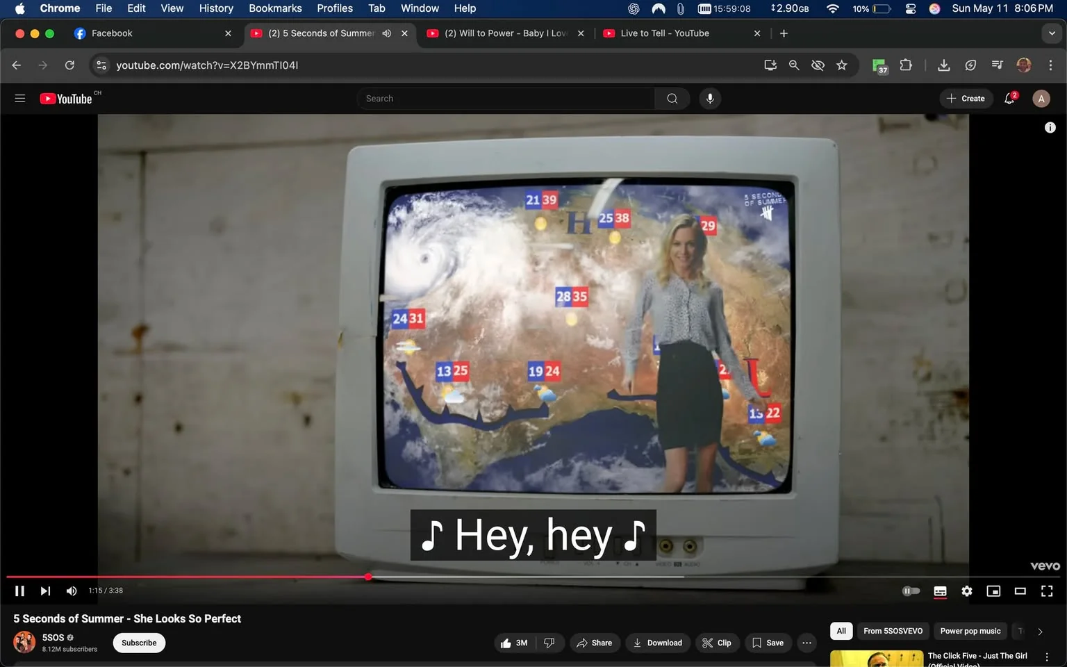 The image features an old-fashioned television set displaying a weather forecast. The TV is white with a slightly rounded screen and appears to be situated against a textured, possibly wooden, wall that has some rust stains. The screen shows a weather map of a region, likely depicting parts of the United States, with various weather symbols and temperature readings.

In the foreground, a woman stands in front of the weather map. She has long, wavy blonde hair and is wearing a light-colored blouse with a black and white pattern, paired with a black skirt that falls just above her knees. Her facial expression is cheerful, and she appears to be gesturing towards the weather map, possibly indicating different weather conditions. 

The weather map itself includes several temperature readings displayed in red numbers, such as "24," "31," "25," "38," and "22," along with weather icons like sun and clouds. There is a large storm system depicted in the upper left corner of the map, resembling a hurricane, with swirling clouds. The map also features lines indicating weather fronts.

The overall setting gives a nostalgic feel, reminiscent of older television broadcasts. The lighting appears bright, focusing on the woman and the screen, while the background remains somewhat muted. The image captures a moment likely from a music video, as indicated by the text overlay at the bottom, which includes musical notes and the phrase "Hey, hey." 

No logos or trademarks are visible in the image. The focus remains on the woman and the weather presentation, with no additional identifiable brands or products present.