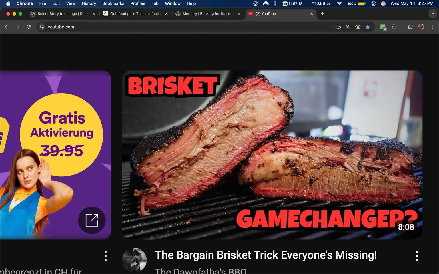 The image displays a YouTube interface featuring a video thumbnail prominently showcasing brisket. The brisket appears to be sliced, revealing a juicy interior with a pinkish hue, surrounded by a dark, charred crust. The text overlay on the thumbnail reads "BRISKET" in bold, red letters, with the word "GAMECHANGER?" also in red, positioned below the main title. The background of the thumbnail is slightly blurred, suggesting a cooking or grilling environment, possibly with a grill or smoker in use.

To the left of the thumbnail, there is a purple advertisement featuring a circular yellow badge that states "Gratis Aktivierung" with a price of "39.95" below it. The advertisement includes a young woman with long hair, wearing a blue and orange outfit, who appears to be listening or paying attention, indicated by her hand raised to her ear.

The overall setting of the image is a dark-themed YouTube interface, with the video thumbnail being the focal point. The time displayed in the top right corner shows "11:57:18," and the date is noted as "Wednesday, May 14." The video duration is indicated as "8:08" at the bottom of the thumbnail, suggesting it is a cooking or BBQ-related video.

No identifiable people or specific brands are present in the image aside from the YouTube logo and the visible elements of the advertisement. The overall aesthetic is visually appealing, aimed at attracting viewers interested in cooking, particularly BBQ and brisket preparation.