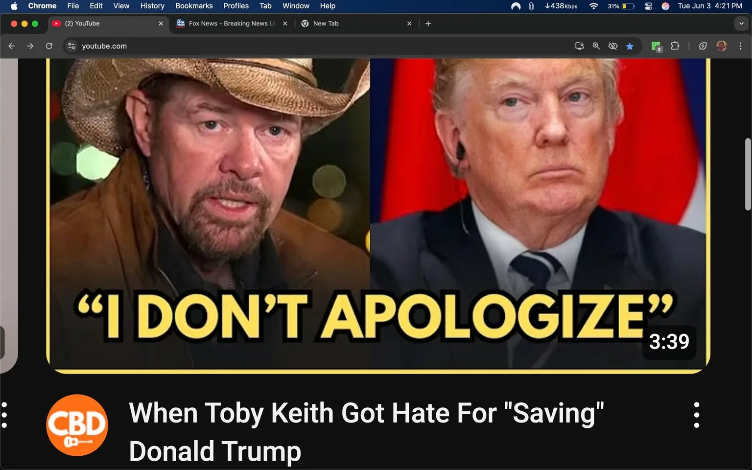 The image features two prominent figures side by side. On the left, a man with a rugged appearance is wearing a cowboy hat and a brown jacket. He has facial hair, including a mustache and goatee, and appears to be speaking or expressing a strong emotion, as indicated by his serious facial expression. The background behind him is blurred, suggesting an outdoor or casual setting with soft lighting.

On the right, a man with a distinct hairstyle is wearing a dark suit and a light blue tie. He has a serious expression, with his lips pressed together and his gaze directed slightly off-camera. The background behind him is a solid color, possibly red, which contrasts with his attire.

In the center of the image, there is bold text that reads, "I DON'T APOLOGIZE," in large yellow letters, which stands out against the darker background. Below the images, there is additional text that states, "When Toby Keith Got Hate For 'Saving' Donald Trump," indicating the context of the content. The video duration is displayed as "3:39."

The overall layout suggests this is a thumbnail for a video, likely related to a discussion or commentary involving the two figures mentioned. The branding at the bottom left features an orange circle with a guitar icon, indicating it may be associated with a music or entertainment platform.