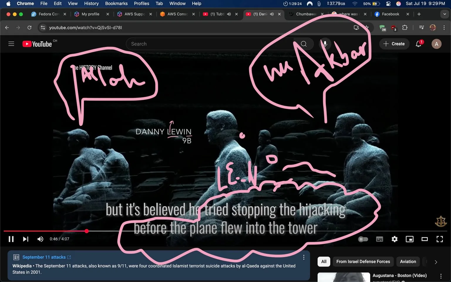 The image shows a paused scene from a YouTube video, likely related to the September 11 attacks, as indicated by the text at the bottom. It features a stylized, possibly animated depiction of two figures seated, with a focus on one figure labeled "DANNY LEWIN 9B." The figures appear somewhat ghostly or translucent, suggesting a somber or memorial tone.

Text overlays in pink indicate phrases like "Allahu Akbar" and "LE.WN," which could imply a controversial or sensitive context, given the association of the phrase with Islamic extremism. The background is dark, enhancing the serious nature of the content. 

The overall tone appears to be reflective or investigative, possibly exploring themes of heroism or tragedy. The presence of the Wikipedia link at the bottom suggests an educational intent, but the highlighted phrases may evoke strong emotional responses and could be seen as provocative. The image raises potential reputational risks due to its sensitive subject matter and the implications of the text.