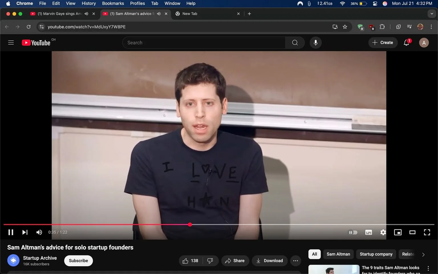 The image shows a man seated in front of a classroom setting, speaking directly to an audience. He has short, dark hair and is wearing a black t-shirt with the text "I LOVE H" printed on it, where the "O" is represented by a heart symbol. The background features a brown chalkboard and a whiteboard, suggesting an educational environment.

His facial expression is serious and focused, indicating he is engaged in a discussion or giving advice. His body language is open, with his hands resting on his knees, suggesting a relaxed yet attentive demeanor. The video title below indicates that he is sharing advice for solo startup founders, hinting at a motivational or instructive tone.

The bottom left corner displays the YouTube interface, including the video progress bar and viewer engagement metrics, such as "138" likes. The overall mood appears to be informative and supportive, aimed at aspiring entrepreneurs.