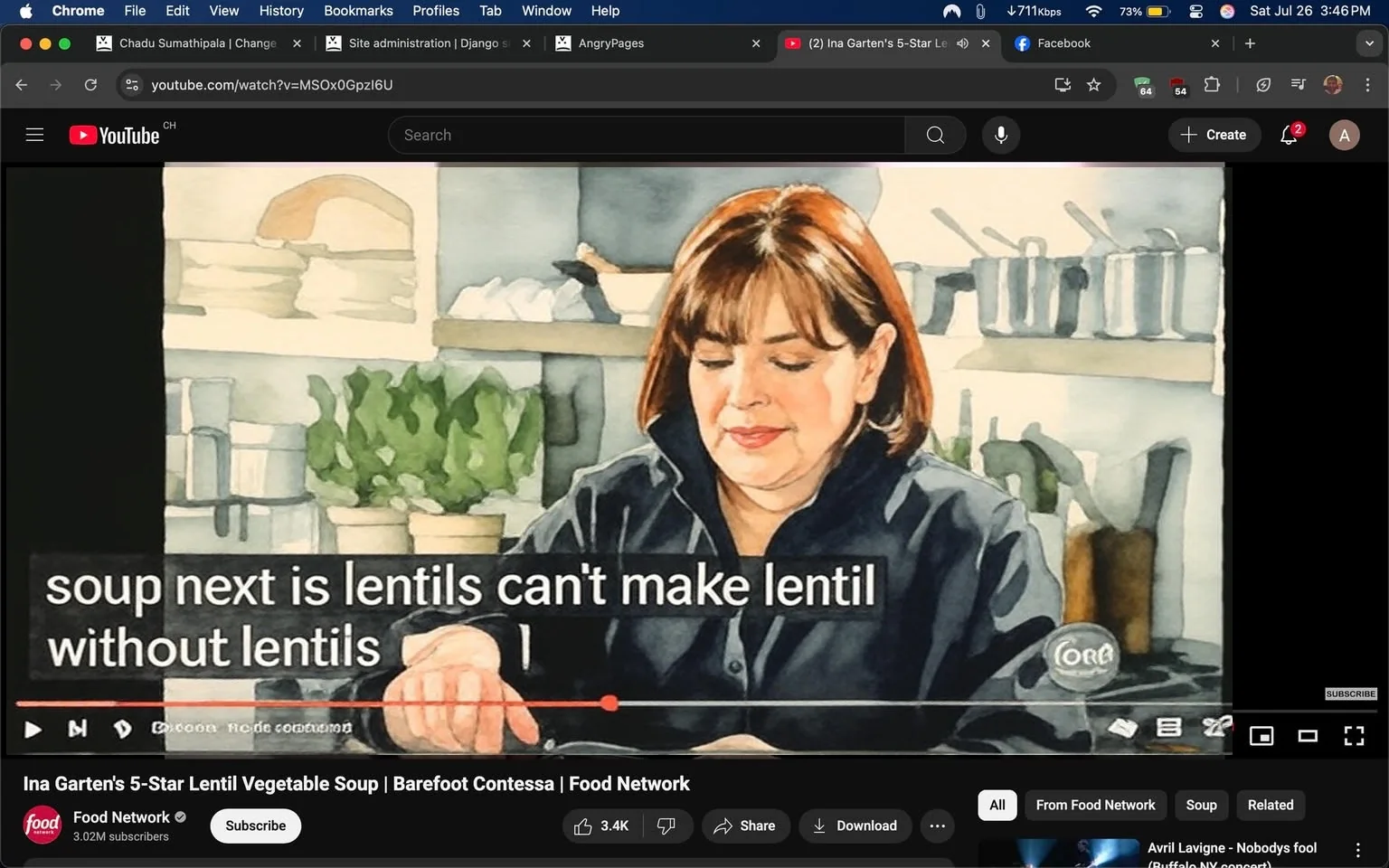 The image captures a scene from a cooking show, specifically featuring a segment from "Barefoot Contessa," hosted by Ina Garten. She is in a well-equipped kitchen that exudes a warm and inviting atmosphere, characterized by soft lighting and a clean, organized layout. In the background, you can see various kitchen tools and pots hanging on a rack, indicating a professional cooking environment.

Ina is dressed in a black jacket, which adds a touch of elegance to her appearance. Her hair is styled in soft waves, framing her face as she engages with the camera and her audience. There’s a sense of enthusiasm and warmth in her expression, suggesting she is passionate about the cooking process. She appears to be in the midst of preparing a lentil soup, as indicated by the subtitle that reads, “soup next is lentils can’t make lentil soup without lentils.” This line highlights her playful and informative approach to cooking, making it accessible for viewers.

The kitchen is adorned with potted herbs, adding a fresh and vibrant touch to the setting. The presence of these plants not only enhances the visual appeal but also signifies the importance of fresh ingredients in her recipes. The overall ambiance is cozy and inviting, making it feel like a friendly gathering rather than a formal cooking demonstration.

The video interface at the bottom of the image shows the title of the episode, "Ina Garten's 5-Star Lentil Vegetable Soup," along with the branding of the Food Network. This branding is prominent, indicating the show's affiliation and suggesting a level of credibility and quality associated with the content. The viewer can also see the number of likes and shares, which reflects the popularity of the episode and the positive reception it has received from the audience.

Overall, the image encapsulates a moment of culinary creativity, showcasing Ina Garten's engaging personality and her love for cooking, particularly with wholesome ingredients like lentils. The scene invites viewers to join her in the kitchen, making them feel like part of the experience as she shares her expertise and tips for creating delicious meals.