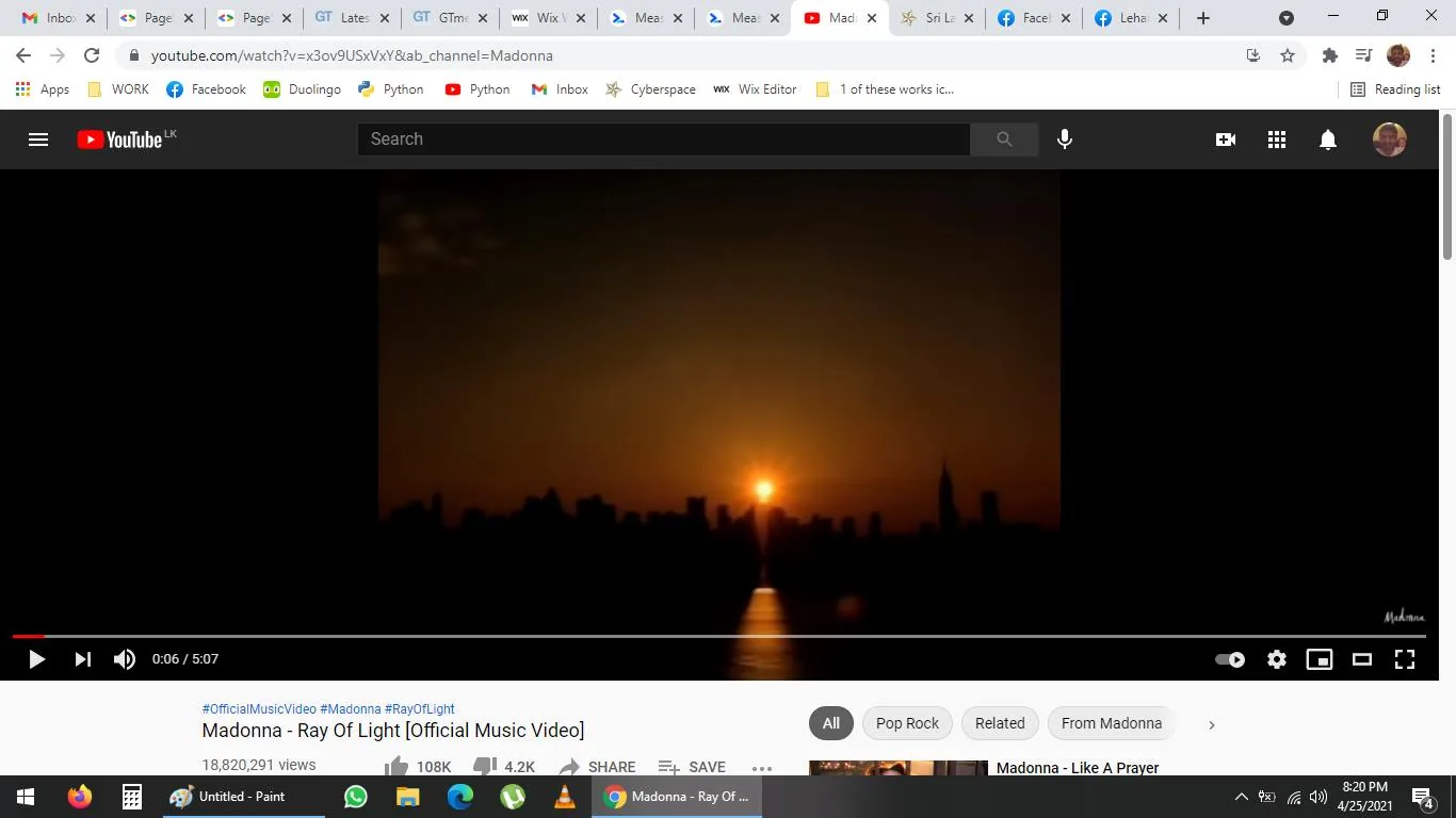 The screenshot shows a YouTube page featuring the official music video for "Ray Of Light" by Madonna. The scene displays a striking skyline silhouette with the sun setting or rising in the background, casting a warm, orange glow across the horizon. This imagery suggests a sense of tranquility and transition, fitting for a music video theme. The video progress bar at the bottom indicates that the video is at the 6-second mark of its 5:07 total runtime.
The YouTube interface is visible, with standard elements like the video title, view count, thumbs up and down icons, share, and save options. The video has over 18 million views, and there's a prominent "108K" likes count. Tags like #OfficialMusicVideo, #Madonna, and #RayOfLight are displayed, indicating the song's association and categorization.
- Title: "Madonna - Ray Of Light [Official Music Video]"
- Channel / profile: "Madonna"
- Site / app: "YouTube"