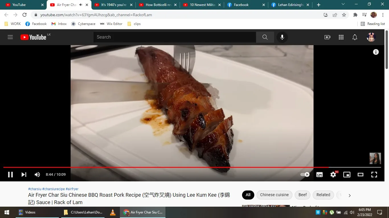 ```
**SECTION 2: Rich Description**
The screenshot captures a scene from a YouTube video titled "Air Fryer Char Siu Chinese BBQ Roast Pork Recipe (空气炸叉烧) Using Lee Kum Kee (李锦记) Sauce | Rack of Lam." This video is hosted on the Rack of Lam channel. The scene shows a close-up of a piece of char siu, a type of Chinese BBQ roast pork, which is presented on a white rectangular plate. The pork appears caramelized and glossy, showing the rich, reddish-brown hue characteristic of char siu. The meat is sliced, revealing succulent layers and a glistening surface, indicating it’s freshly cooked.
A fork is seen on the left side of the pork, suggesting that it has just been used to slice the meat, which is lying in a pool of its own juices on the plate. The setting appears to be a kitchen countertop, judging by the marble texture in the background. The lighting is bright and warm, enhancing the appetizing look of the dish. The YouTube interface elements are visible, including the title and progress bar at the bottom of the screen, indicating that the video is at the 8:44 mark out of 10:09. Tags below the video suggest it's related to Chinese cuisine, emphasizing the use of an air fryer for cooking.
- Title: "Air Fryer Char Siu Chinese BBQ Roast Pork Recipe (空气炸叉烧) Using Lee Kum Kee (李锦记) Sauce | Rack of Lam"
- Channel / profile: "Rack of Lam"
- Site / app: "YouTube"