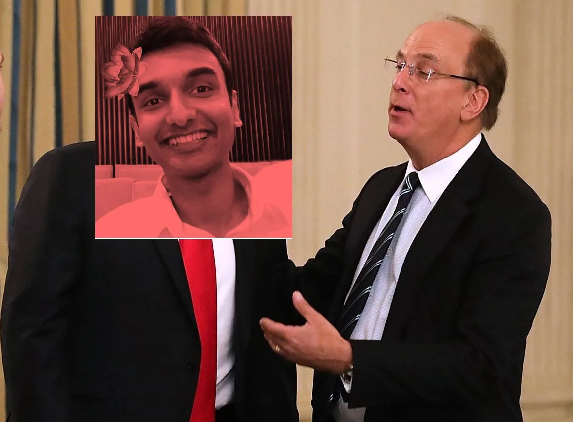 The image appears to show a business or formal event, set indoors with a curtain in the background. The scene is bright, suggesting ample lighting, possibly from overhead lights, given the formal setting. In the image, Larry Fink, wearing a dark suit, a white shirt, and a striped tie, is engaged in conversation. His posture is open, with one hand gesturing as if making a point or emphasizing his speech. He appears to be speaking to someone next to him.
However, the image has been edited. The face of the person next to him has been replaced with a photoshopped photo of Lehan Edirisinghe, who is smiling broadly. The added face has a red tint and includes a decorative flower in the hair, contrasting with the otherwise formal attire of a suit and red tie. The editing creates a humorous and surreal element to the image, blending a casual, playful portrait into a formal setting. The overall composition is centered on the interaction between the two figures, with the focus on the contrast between the serious and casual elements created by the photoshopping.