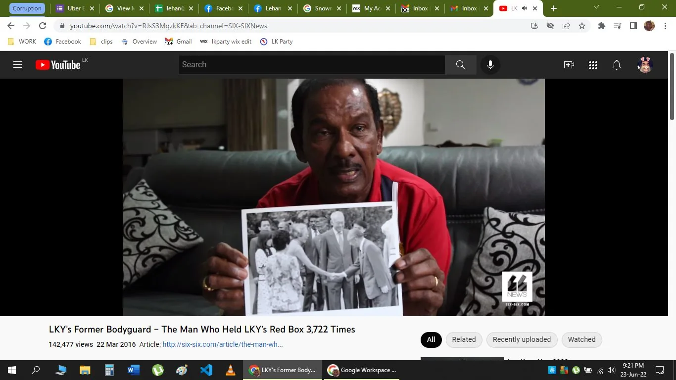 The image is a screenshot from a YouTube video titled "LKY's Former Bodyguard – The Man Who Held LKY's Red Box 3,722 Times," featured on the channel SIX-SIXNews. The scene captures an indoor interview setting. A man, presumably LKY's former bodyguard, is sitting on a sofa, holding up a black-and-white photograph. The man is wearing a red shirt, and the room appears to be modestly decorated, with patterned cushions visible on the sofa beside him.
The photograph he holds depicts a group of people, one of whom is shaking hands with another individual. The context suggests this might be a significant historical or personal photo related to the man’s experiences. The lighting is soft, adding a calm atmosphere to the setting. The on-screen text indicates the video's view count and publication date, as well as a link to an article on the SIX-SIX website. Overall, the screenshot conveys a reflective moment as the man shares his experiences and memories.
- Title: "LKY's Former Bodyguard – The Man Who Held LKY's Red Box 3,722 Times"
- Channel / profile: "SIX-SIXNews"
- Site / app: "YouTube"