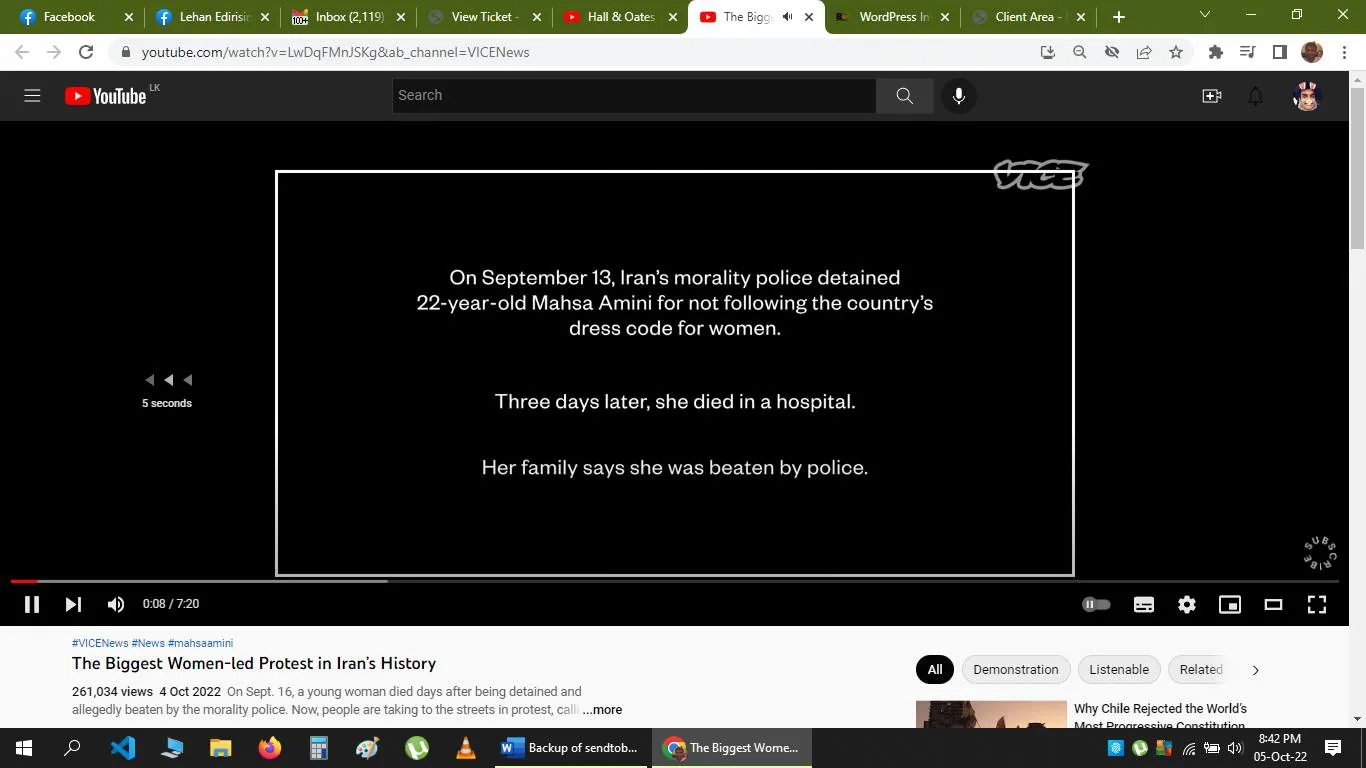 The screenshot is from a YouTube video titled "The Biggest Women-led Protest in Iran’s History," published by VICE News. The video frame shows a black background with white text, providing key information about a significant event involving Mahsa Amini. It states that on September 13, Iran’s morality police detained 22-year-old Mahsa Amini for allegedly not adhering to the country's dress code for women. Three days later, she died in a hospital, with her family claiming she was beaten by police.
The design is minimalistic, focusing solely on delivering this impactful text. The VICE logo is visible in the top right corner, indicating the publisher. Below the video, metadata shows it has 261,034 views and was published on October 4, 2022. The video is part of a broader discussion about protests in Iran, as indicated by the hashtags "#News" and "#mahsaamini." The scene's stark contrast enhances the gravity of the message, aimed at informing viewers about the sociopolitical context and the ensuing protests.