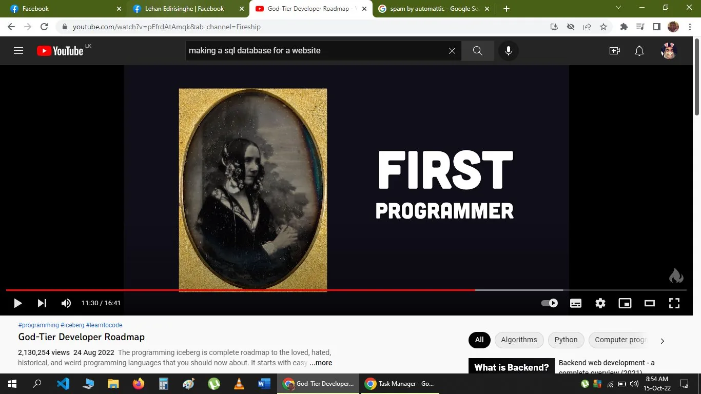 The image is a screenshot from a YouTube video titled "God-Tier Developer Roadmap" on the channel Fireship. The video appears to discuss programming topics, as indicated by the hashtags #programming, #iceberg, and #learntocode. The frame shows a historical photograph in a gold oval frame on the left side, set against a dark background. The text "FIRST PROGRAMMER" is prominently displayed to the right of the photograph. The historical image suggests the subject of the discussion might be about an early figure in programming history. The screenshot is taken at 11 minutes and 30 seconds into the video, and the video has over 2 million views since it was uploaded on August 24, 2022. The visual style is clean and modern, with a focus on delivering informative content related to programming history and concepts.