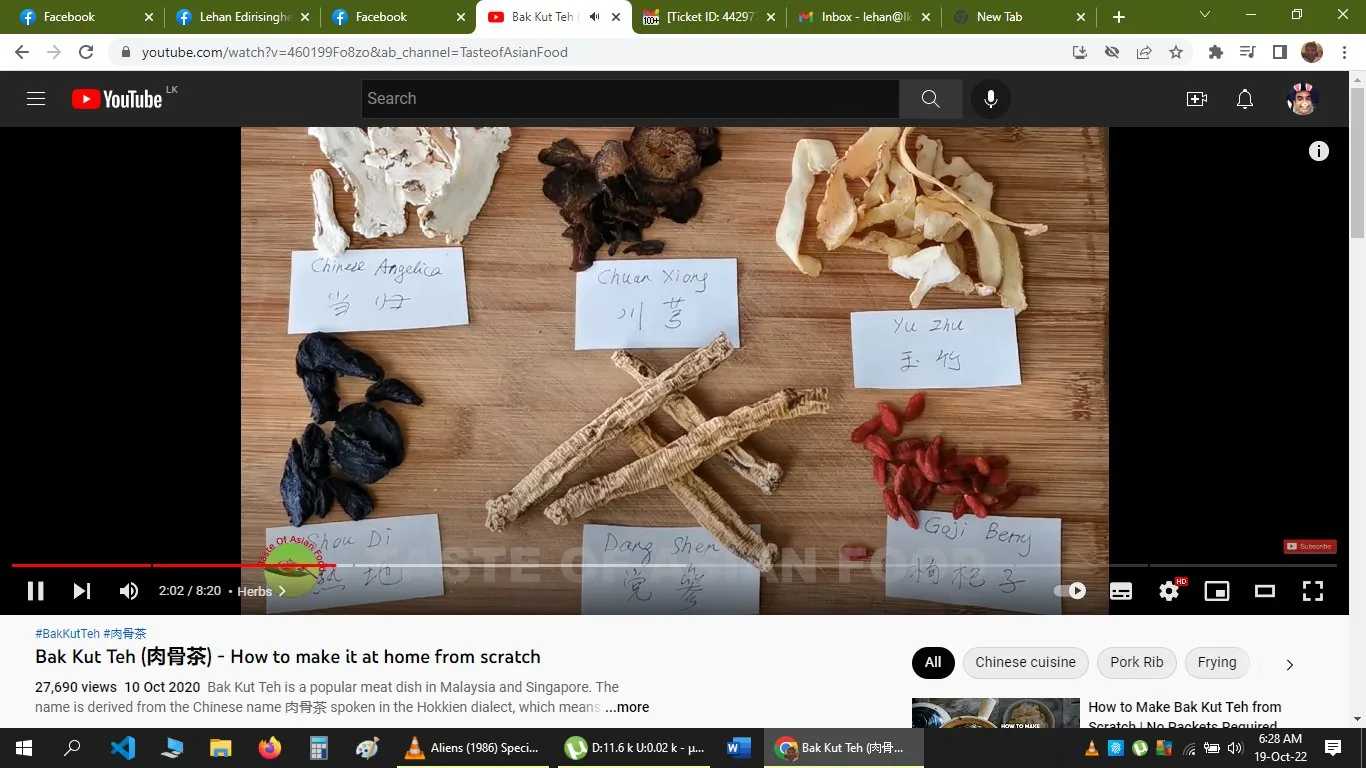 The image is a YouTube screenshot from a video titled "Bak Kut Teh (肉骨茶) - How to make it at home from scratch" by the channel Taste of Asian Food. The scene features an assortment of herbs and ingredients arranged on a wooden surface, each labeled with its name. Visible labels include "Chinese Angelica," "Chuan Xiong," "Yu Zhu," "Shou Di," "Dang Shen," and "Goji Berry." These are key ingredients for making Bak Kut Teh, a traditional Malaysian and Singaporean dish.
The composition is neatly organized, with each ingredient placed next to a handwritten note. The background is a smooth wooden board, enhancing the natural and authentic feel of the ingredients. The lighting is bright, highlighting the textures and colors of the herbs, such as the dark, wrinkled texture of Shou Di and the vibrant red of Goji Berries. The video was uploaded on October 10, 2020, and has accumulated 27,690 views. It focuses on demonstrating how to cook Bak Kut Teh without using pre-packaged mixes. The tags related to the video include "Chinese cuisine," "Pork Rib," and "Frying," indicating the culinary focus of the content.