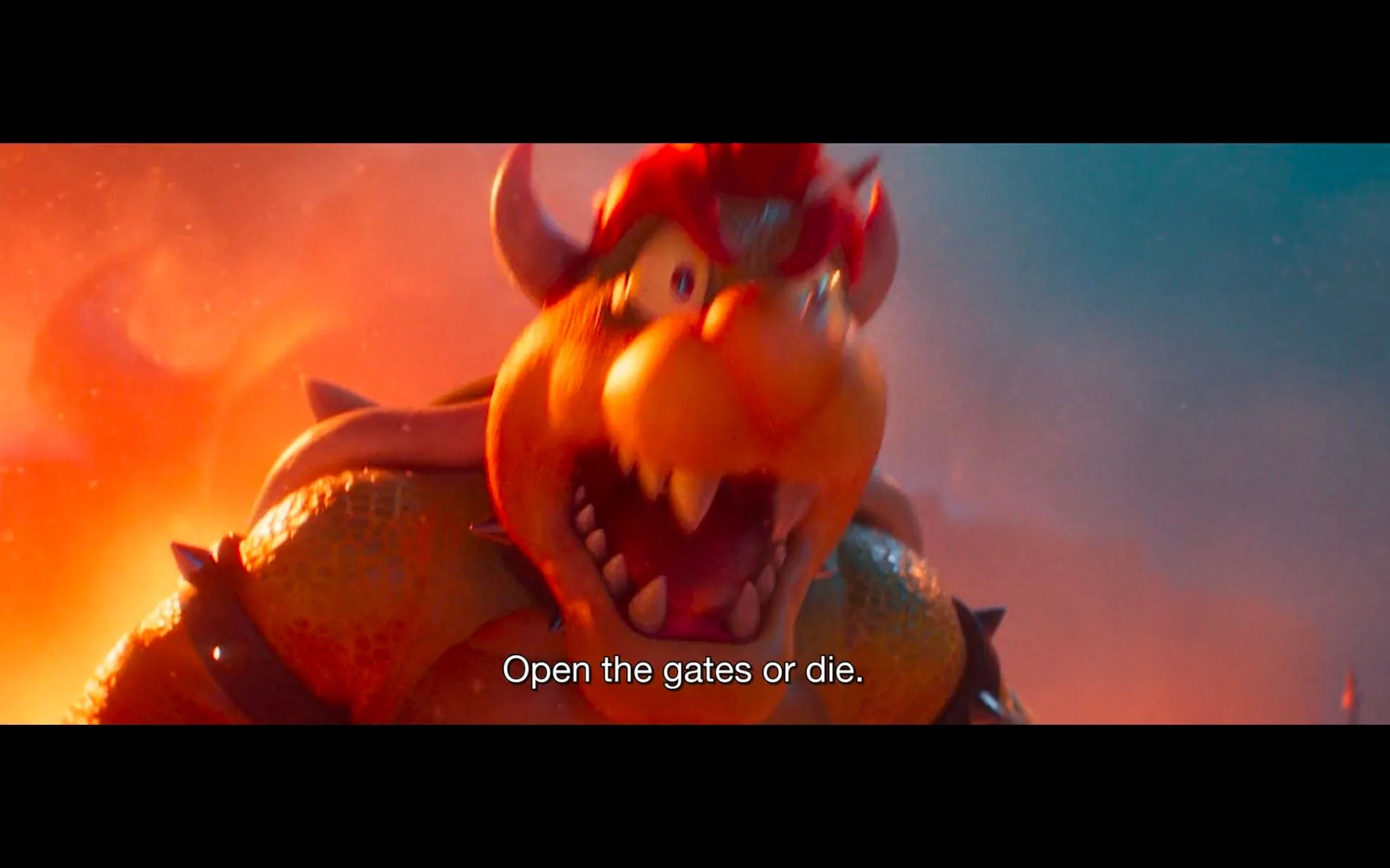The image is a dramatic scene from an animated film featuring the character Bowser from the "Super Mario Bros." franchise. Bowser, a large, dragon-like creature with orange skin, is shown in an aggressive and commanding posture. He has sharp teeth, a spiked shell, and wears a menacing expression with his mouth open, delivering the ultimatum, "Open the gates or die." The background is filled with warm hues of orange and red, suggesting a fiery or intense environment that complements Bowser's intimidating presence. The lighting enhances the mood, casting dynamic shadows and highlights on Bowser's distinct features. This frame captures the essence of Bowser's character as a formidable antagonist within the story. The animation style is vibrant and colorful, typical of modern adaptations of classic video game characters.