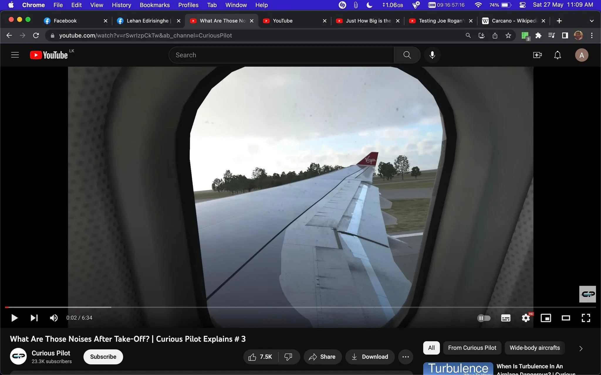 The image is a screenshot from a YouTube video titled "What Are Those Noises After Take-Off? | Curious Pilot Explains # 3" on the channel "Curious Pilot." The scene captures a view from an airplane window, showing the aircraft's wing and a bit of the tail fin, which has the Virgin logo visible. The outside environment appears to be an airport setting with trees in the background, and the lighting suggests daytime with overcast skies. The video duration is 6 minutes and 34 seconds, and the channel has 23.3K subscribers with 7.5K likes on this video. The video seems to explore the various noises passengers might hear after an airplane takes off, likely explaining the reasons behind them from a pilot's perspective. The interface shows standard YouTube playback controls and options like share and download, along with topic tags related to aviation and airplanes.