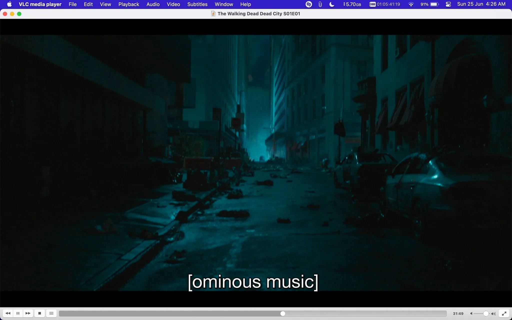 The screenshot shows a scene from the episode "The Walking Dead Dead City S01E01," viewed through VLC media player. The setting is a dark, abandoned street in a city, typical of a post-apocalyptic environment. The scene is dimly lit, with a bluish hue, contributing to the eerie and ominous atmosphere. The street is cluttered with debris and abandoned cars, suggesting chaos and desolation. The buildings on either side of the street are tall and shadowy, adding to the feeling of isolation. The subtitle "[ominous music]" indicates a tense and foreboding moment in the narrative. This visual captures the essence of suspense and danger that is characteristic of "The Walking Dead" series. The overall mood is tense, enhancing the anticipation of what might happen next in the storyline.