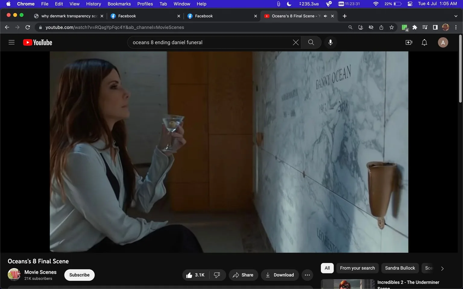 Sandra Bullock is featured in this screenshot from the movie "Ocean's 8." She is seated indoors, holding a martini glass, and appears to be in a contemplative state. The setting is a memorial wall, with a marble surface where the name "DANNY OCEAN" and the years "1943-2018" are inscribed. The lighting is subdued, adding a somber mood to the scene. Sandra Bullock is dressed in a light-colored blouse, her hair is down, and she is looking intently at the wall, suggesting a moment of reflection or tribute. The YouTube interface is visible, with the video titled "Ocean's 8 Final Scene" and hosted on the "Movie Scenes" channel. There are engagement options like "Subscribe" and "Download," as well as viewer interactions such as likes and comments. The overall tone is introspective, capturing a poignant moment from the film.
- Title: "Ocean's 8 Final Scene"
- Channel / profile: "Movie Scenes"
- Site / app: "YouTube"