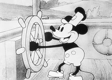The image depicts Mickey Mouse, an iconic character, in a classic black-and-white animation style from the film "Steamboat Willie." Mickey is shown at the helm of a ship, gripping a large steering wheel with a joyful expression. He wears his traditional attire, which includes large white gloves, shoes, and pants with distinct buttons. The background features the ship's deck, with a life preserver hanging on the wall, and a pastoral scene visible through the windows. The overall mood is playful and nostalgic, capturing the charm of early animation. The use of simple lines and shading reflects the era's animation techniques, emphasizing character and expression over intricate detail.