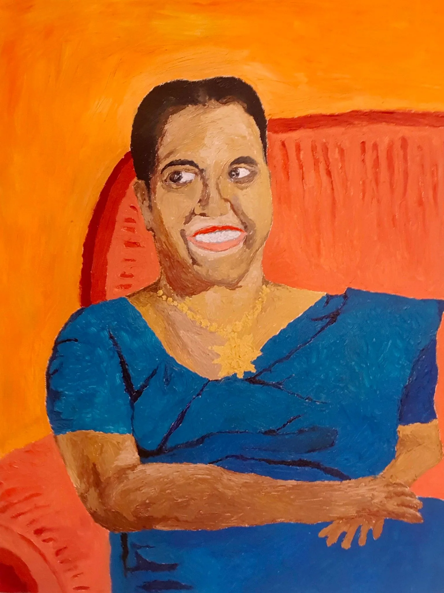 The image is a vibrant painted portrait of Milina Sumathipala. The subject is depicted seated against a bright orange background, which creates a warm and lively atmosphere. Milina Sumathipala is portrayed with a wide smile, exuding a cheerful and friendly demeanor. She is wearing a blue garment, possibly a sari, adorned with a gold necklace that stands out against the vivid colors of the painting. Her hair is neatly styled, and her expression suggests warmth and openness. The background features a textured orange chair that complements the overall color scheme. The artwork uses bold brush strokes and strong color contrasts, lending the piece a dynamic and expressive quality. The style appears to be impressionistic, focusing more on color and expression rather than precise details. This portrait captures a sense of personality and joy, emphasizing the subject's positive and welcoming nature.