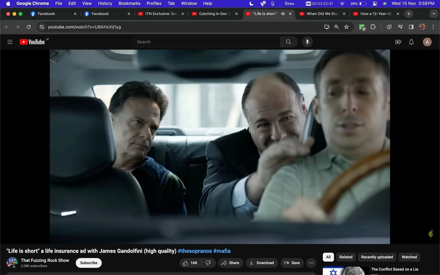 1) Rich description:
The image is a YouTube screenshot featuring a scene from a life insurance advertisement titled "Life is short" with James Gandolfini. It shows three men inside a car, with James Gandolfini sitting in the back seat on the right. He is wearing a suit, and his expression is animated and engaging as he leans forward, appearing to speak to the driver. The man next to him in the back seat looks more serious, creating a contrast with Gandolfini's lively demeanor. The driver in the front seat is focused on the road, steering with a neutral expression. The overall mood is a mix of tension and conversation, typical of a scene that might involve negotiation or persuasion. The lighting inside the car is bright enough to reveal the features of the passengers clearly. The scene evokes themes of dialogue and interaction, possibly hinting at a storyline involving important decisions. The video is hosted on the channel "That Fuzzing Rock Show," and the topic tags suggest a connection to "The Sopranos" and mafia themes.
2) On-screen text block:
- Title: "\"Life is short\" a life insurance ad with James Gandolfini (high quality)"
- Channel / profile: "That Fuzzing Rock Show"
- Site / app: "YouTube"